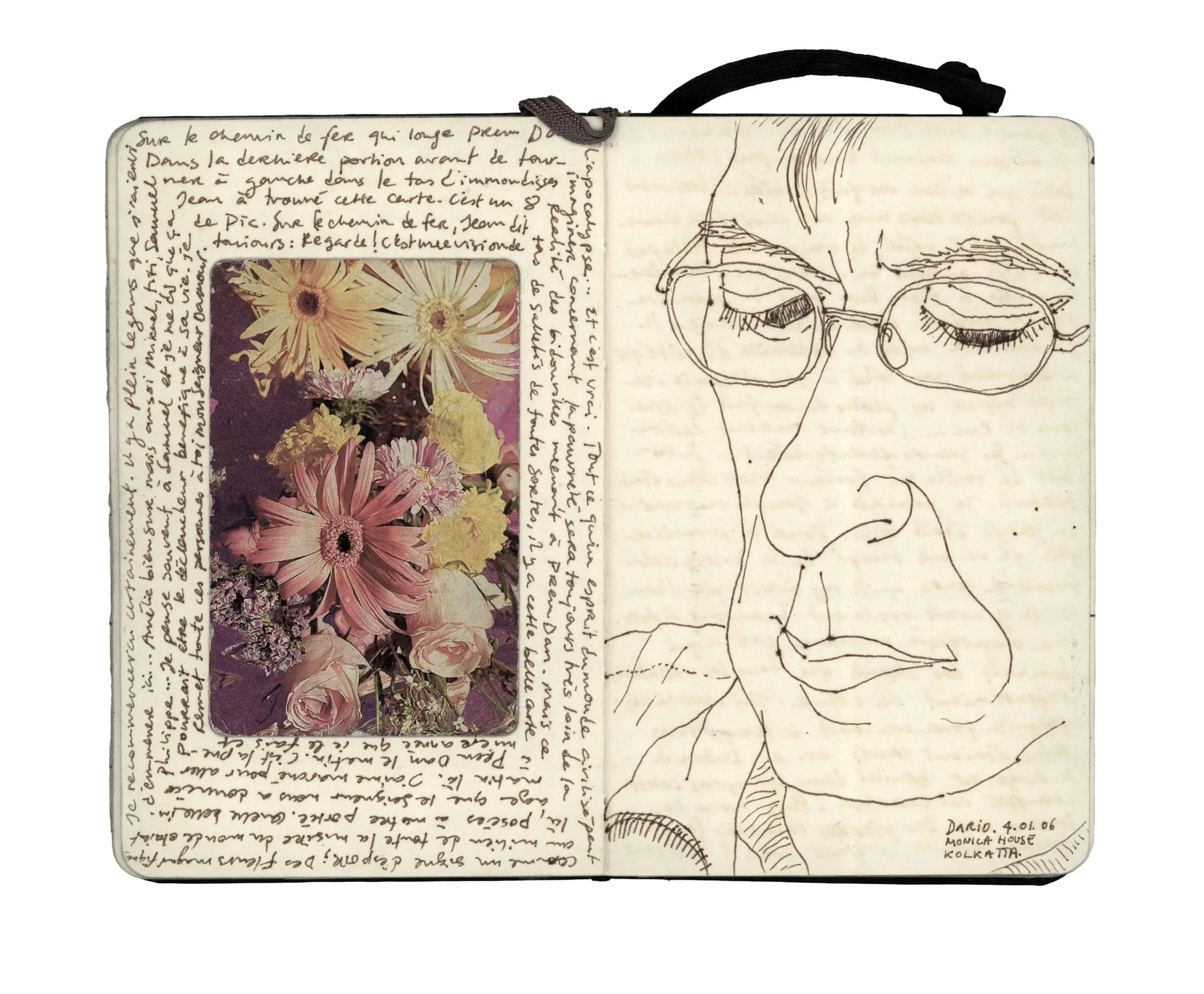 Open notebook with handwritten text, a colorful bouquet photo on the left page, and a sketch of a person's face with glasses on the right page.
