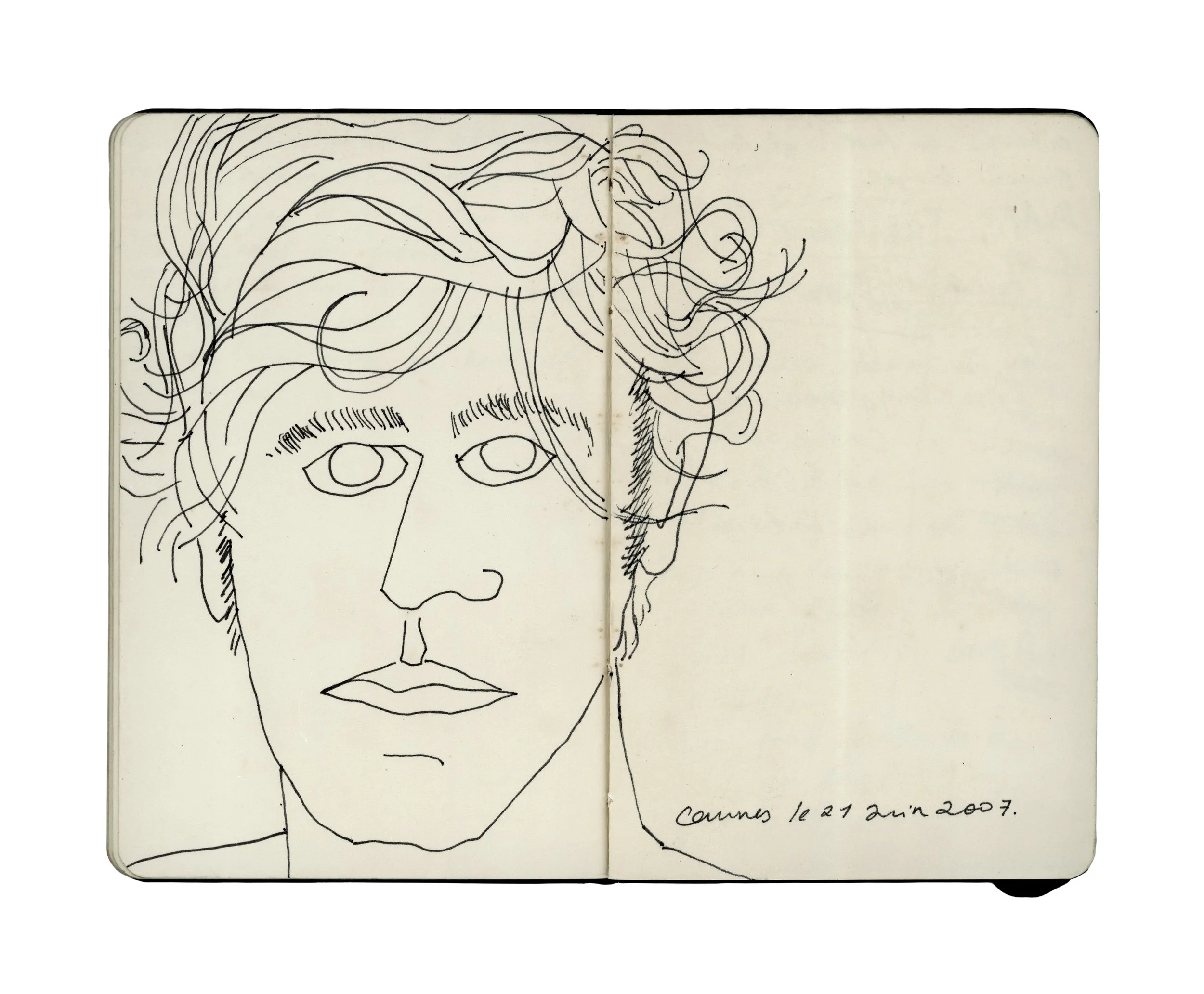 Line drawing of a person's face with curly hair in a sketchbook, dated June 21, 2007, in Cannes.