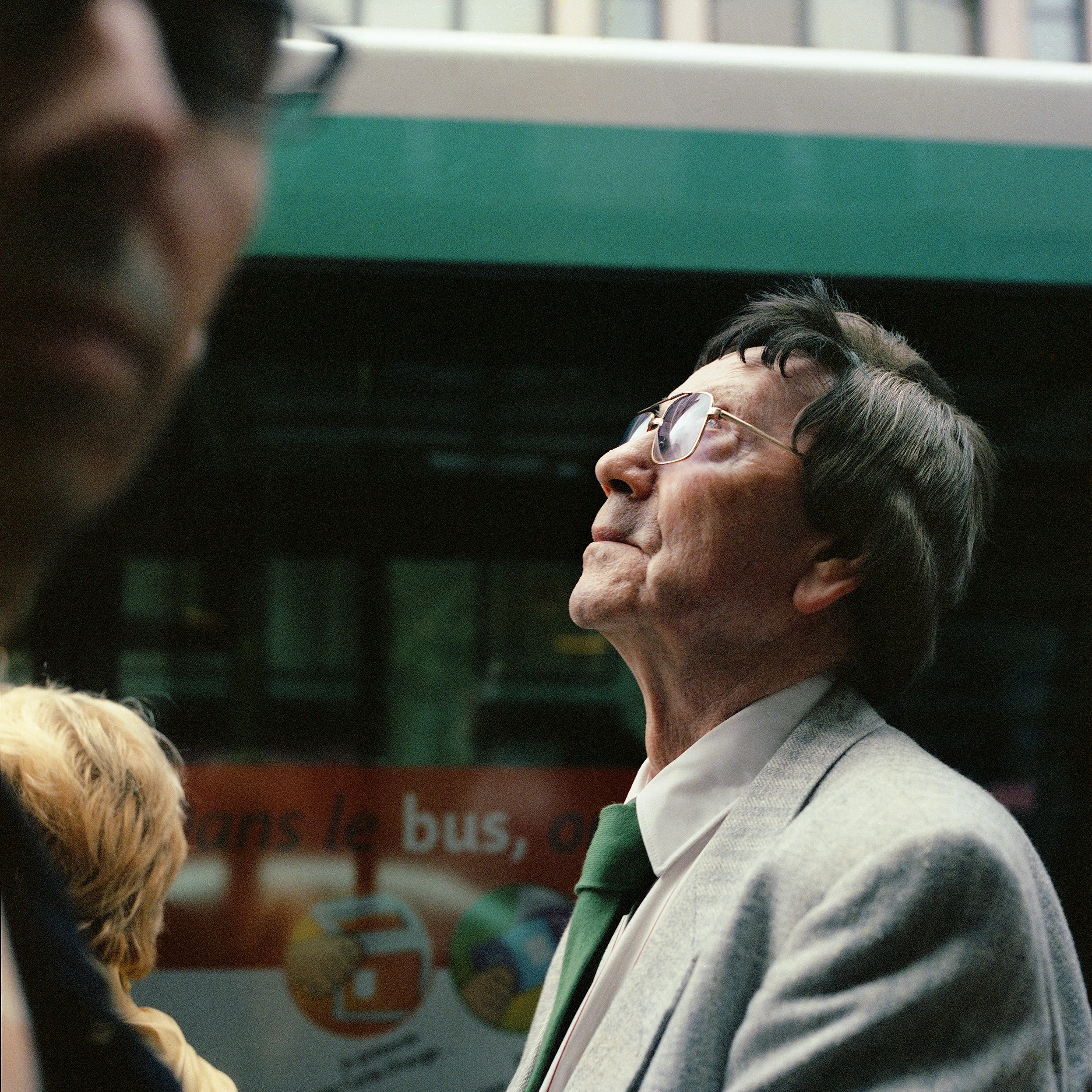 in Paris, Farnce, An old man wearing a wig, with glasses and wearing a gray sweater