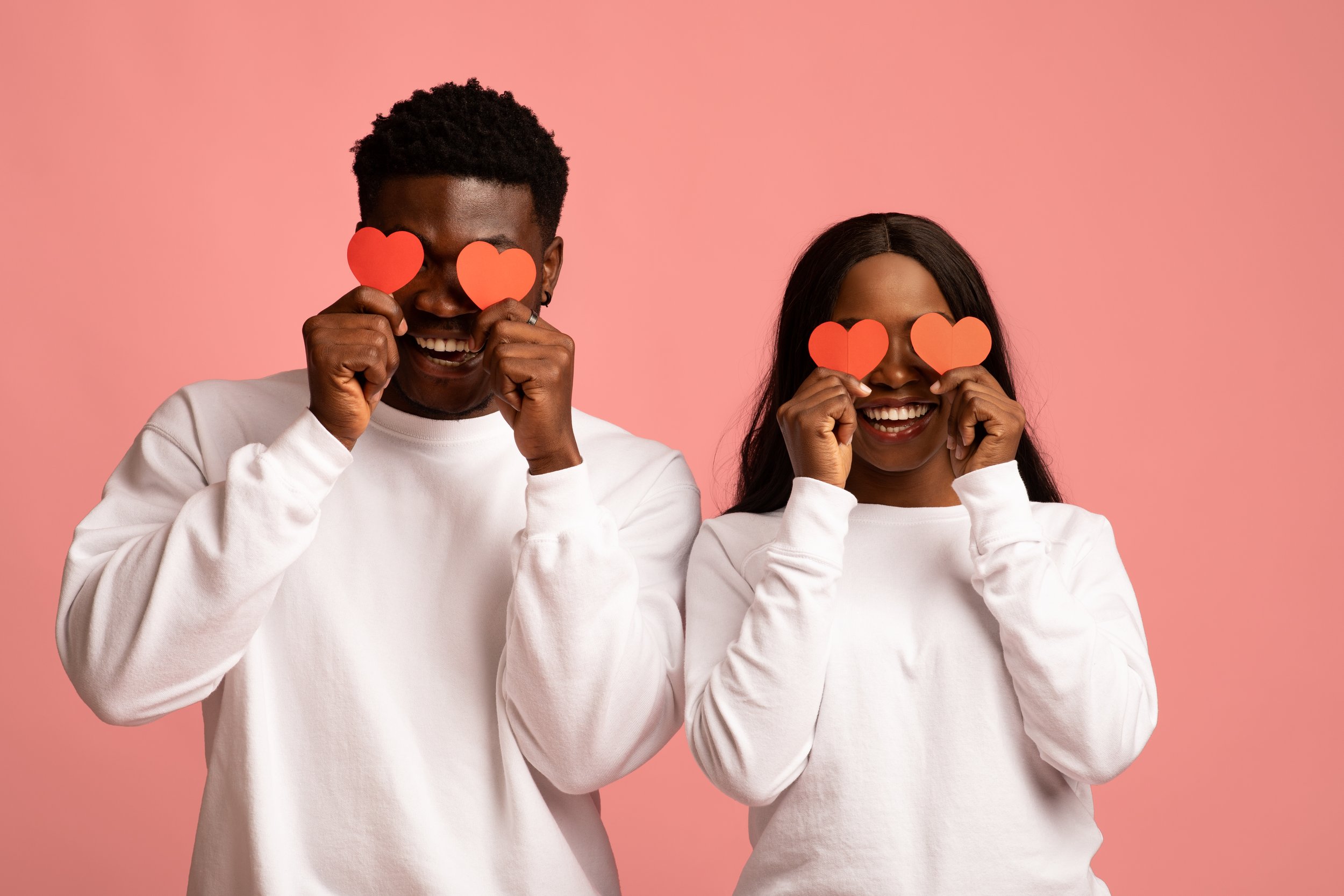 young-black-couple-holding-red-love-hearts-over-ey-2026-01-08-23-09-05-utc.jpg