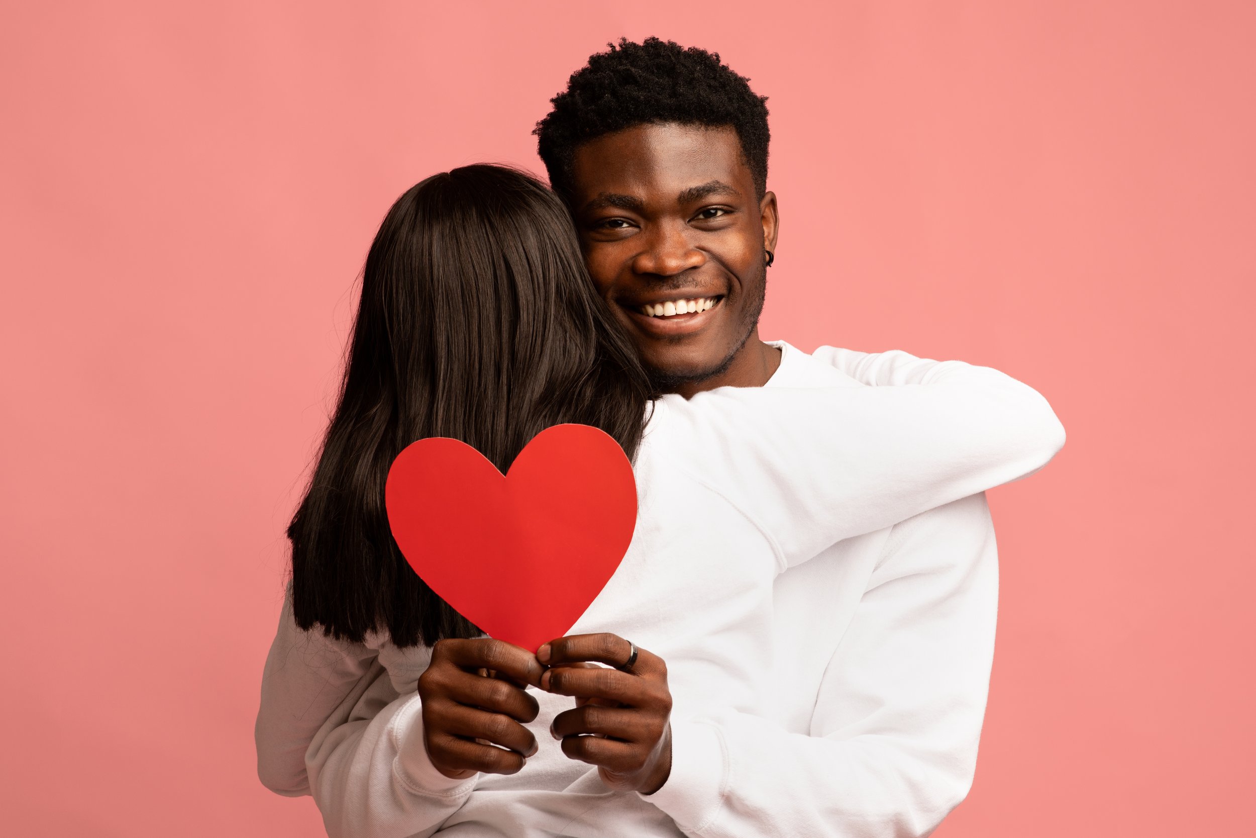 happy-african-american-man-hugging-his-girlfriend-2026-01-08-23-24-37-utc.jpg