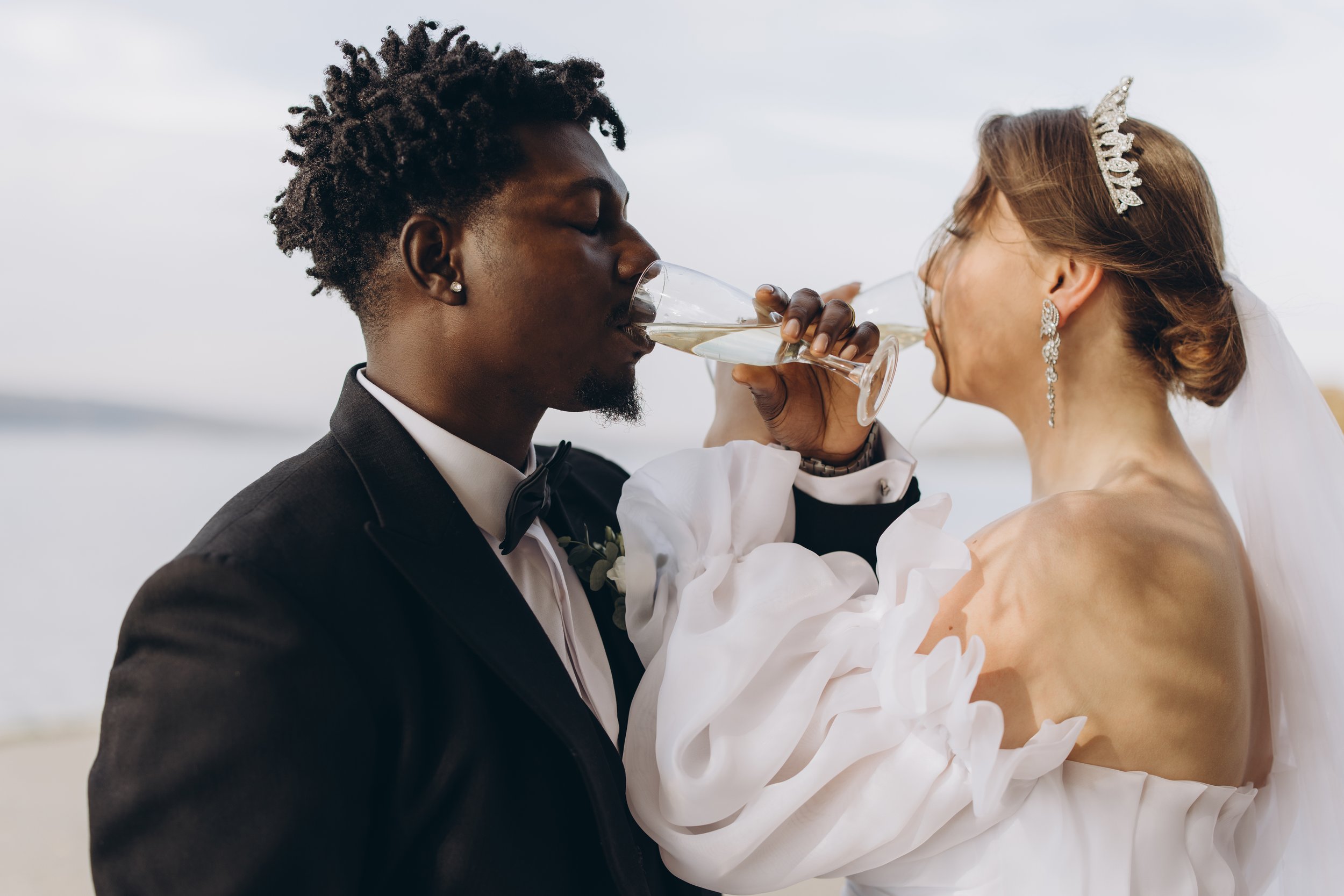 interracial-couple-drinking-champagne-at-wedding-r-2026-01-08-02-08-09-utc.jpg