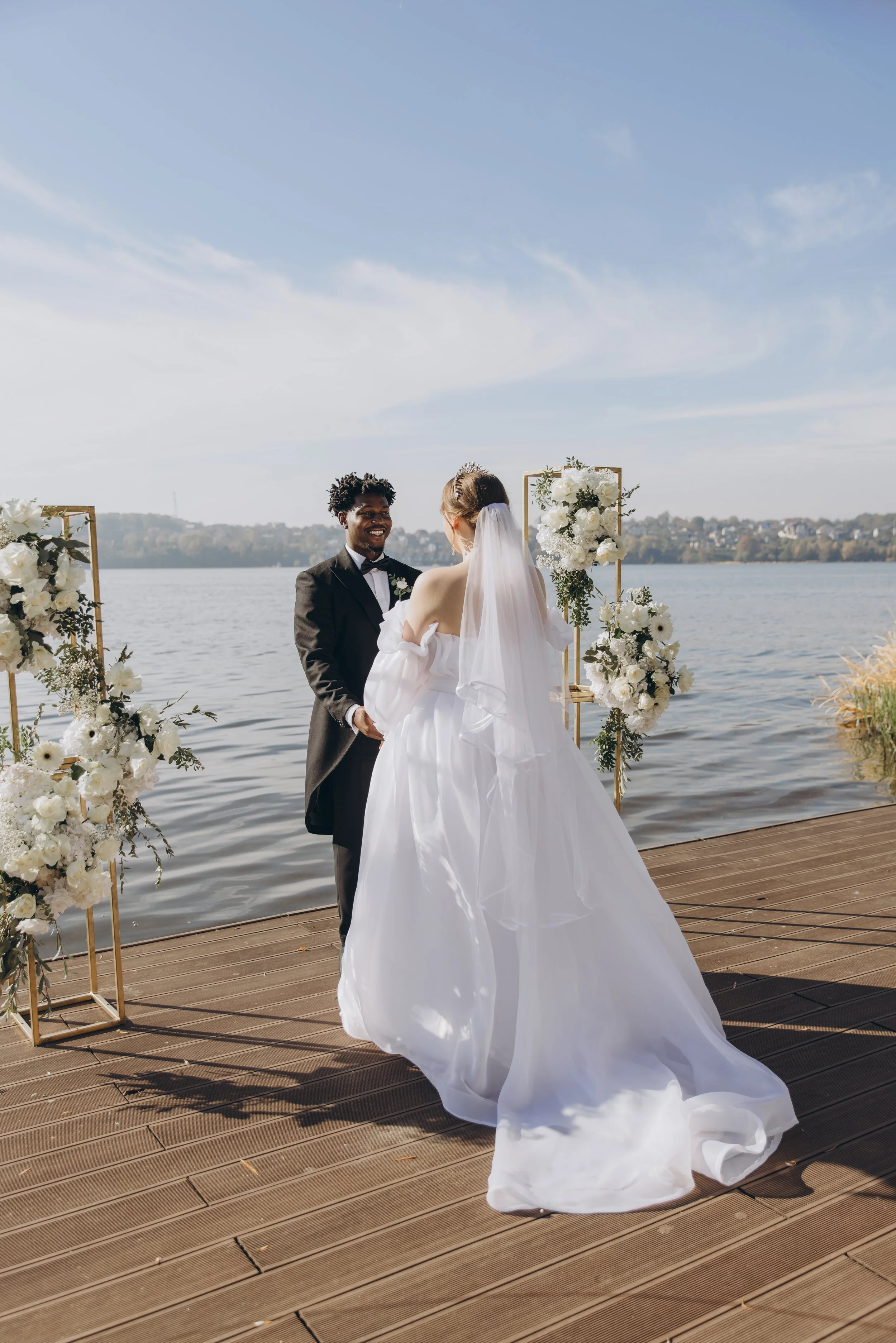 interracial-couple-getting-married-on-a-pier-cele-2026-01-08-02-08-16-utc.jpg
