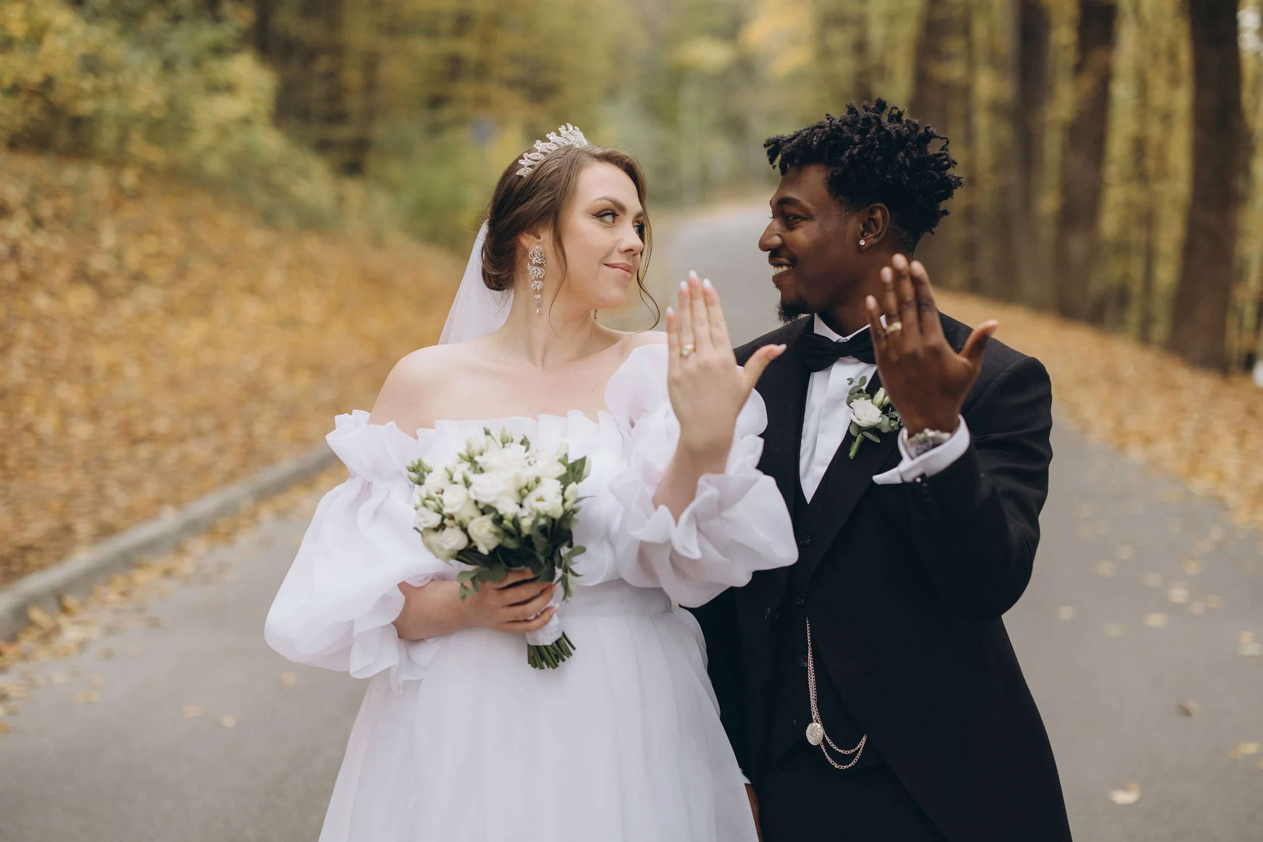 interracial-couple-showing-wedding-rings-on-a-coun-2026-01-08-02-08-11-utc.jpg