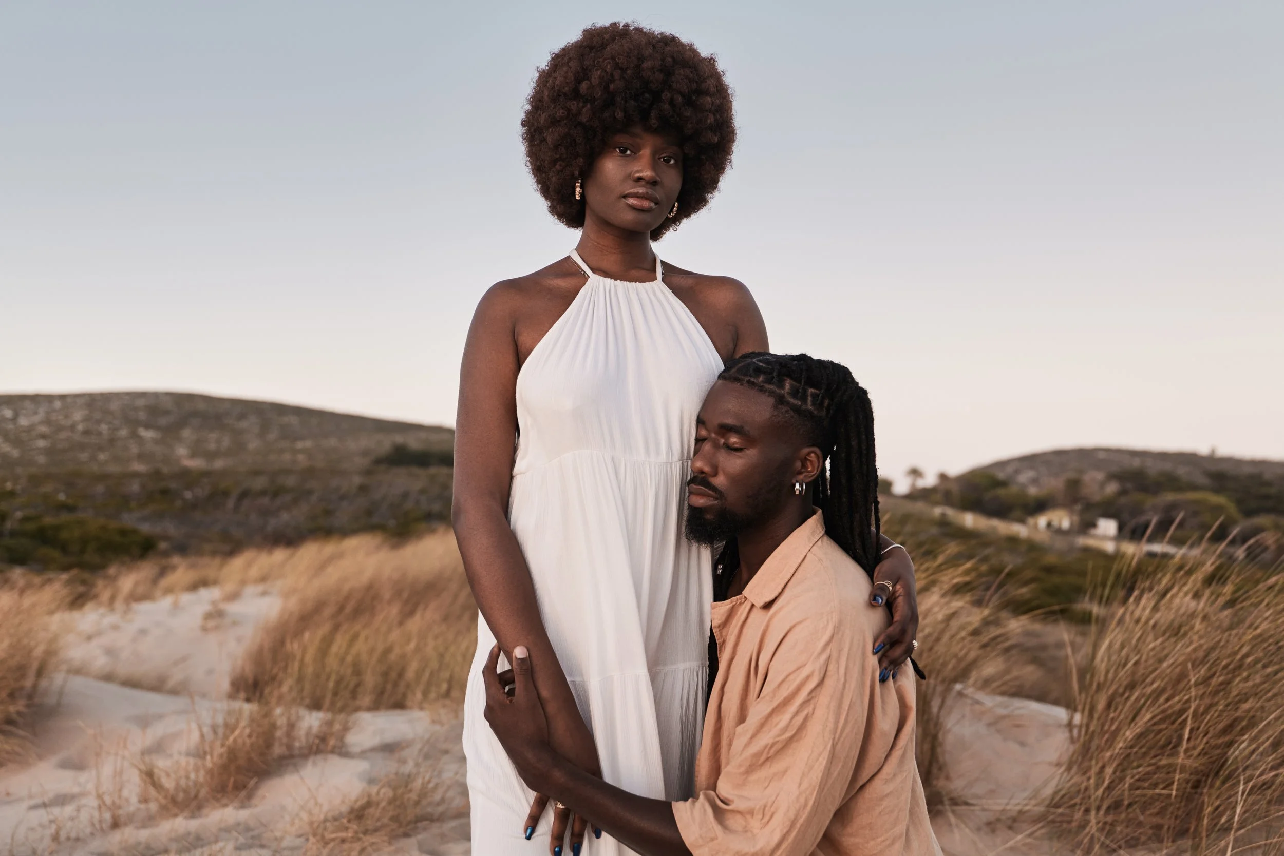 young-black-couple-embracing-on-sandy-beach-with-d-2026-01-09-00-36-58-utc.jpg