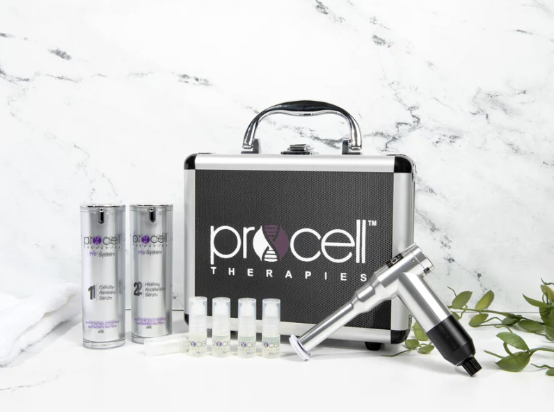 A medical kit with the ProCell Therapies logo, two bottles labeled ProCell System, several small vials, and a handheld device, placed on a white surface with green leafy plant accents.