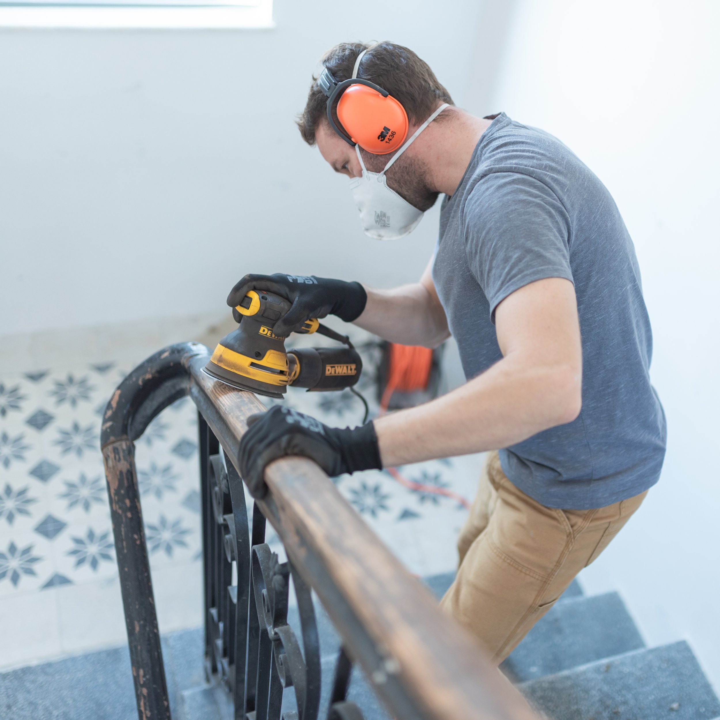 Railing sanding and refinishing completed as part of renovation project in Halifax