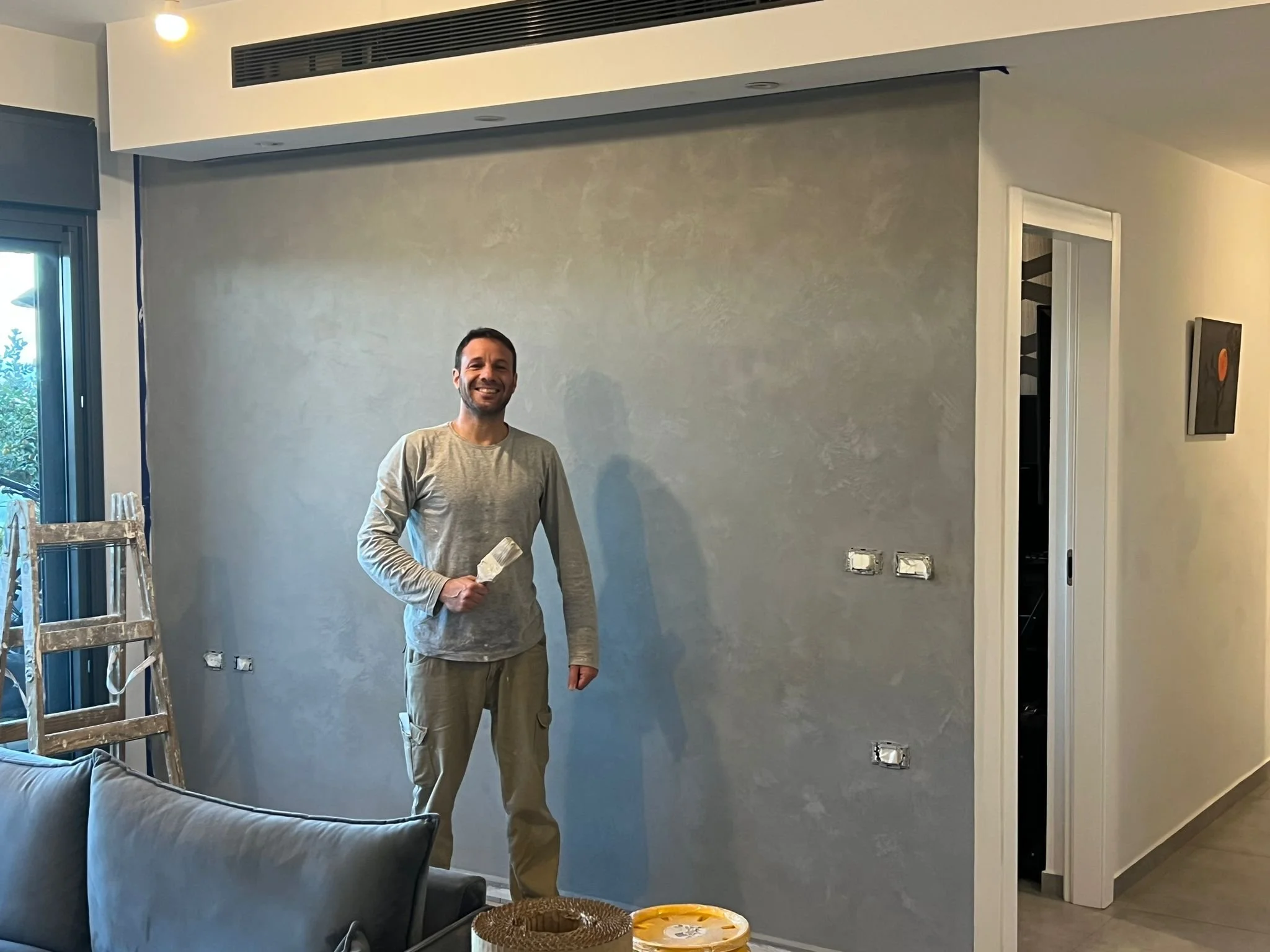 Stucco-style accent wall with decorative finish completed for a residential interior in Durtmouth