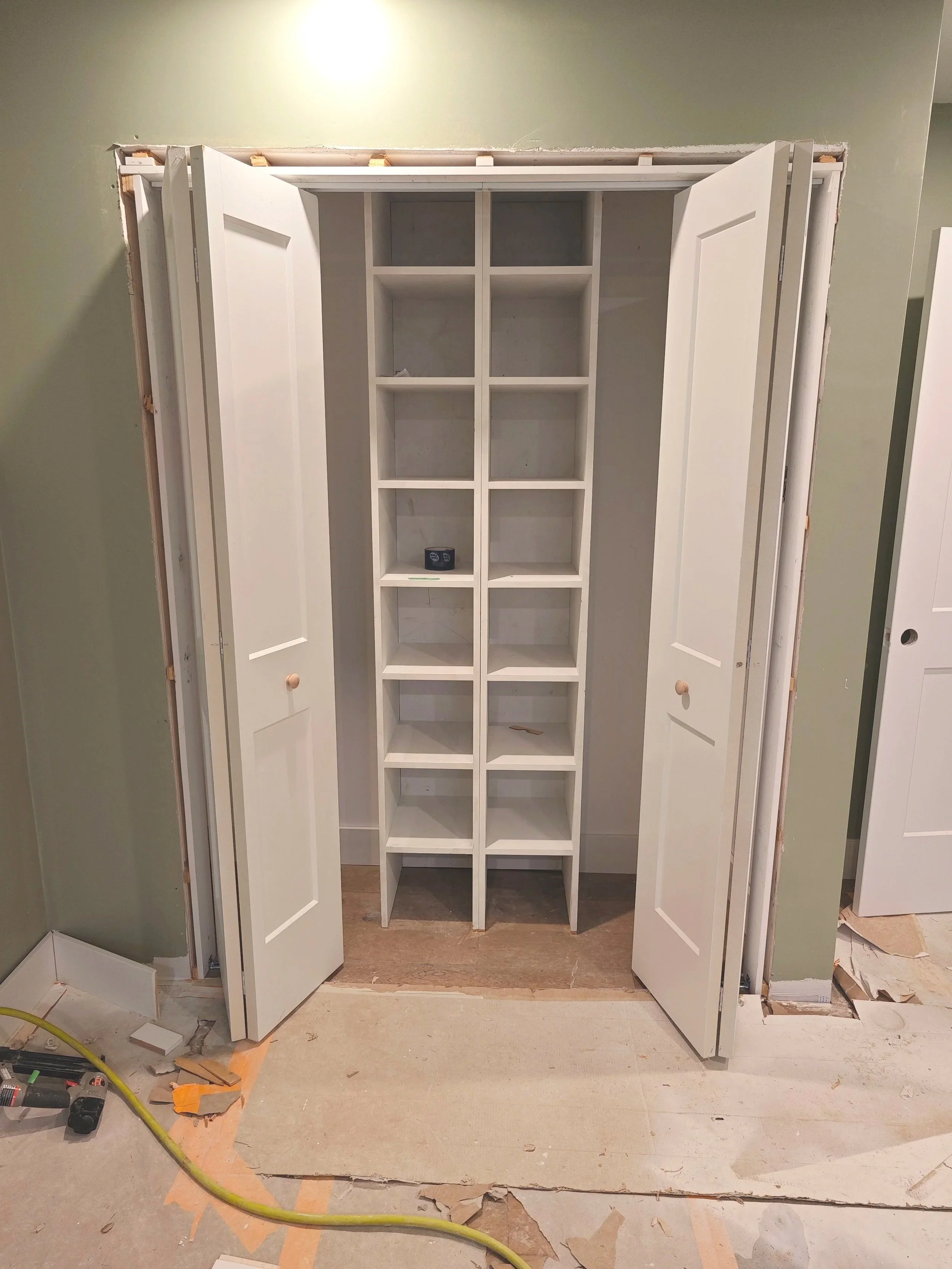 Interior door installation as part of custom built-in wall unit project in Dartmouth