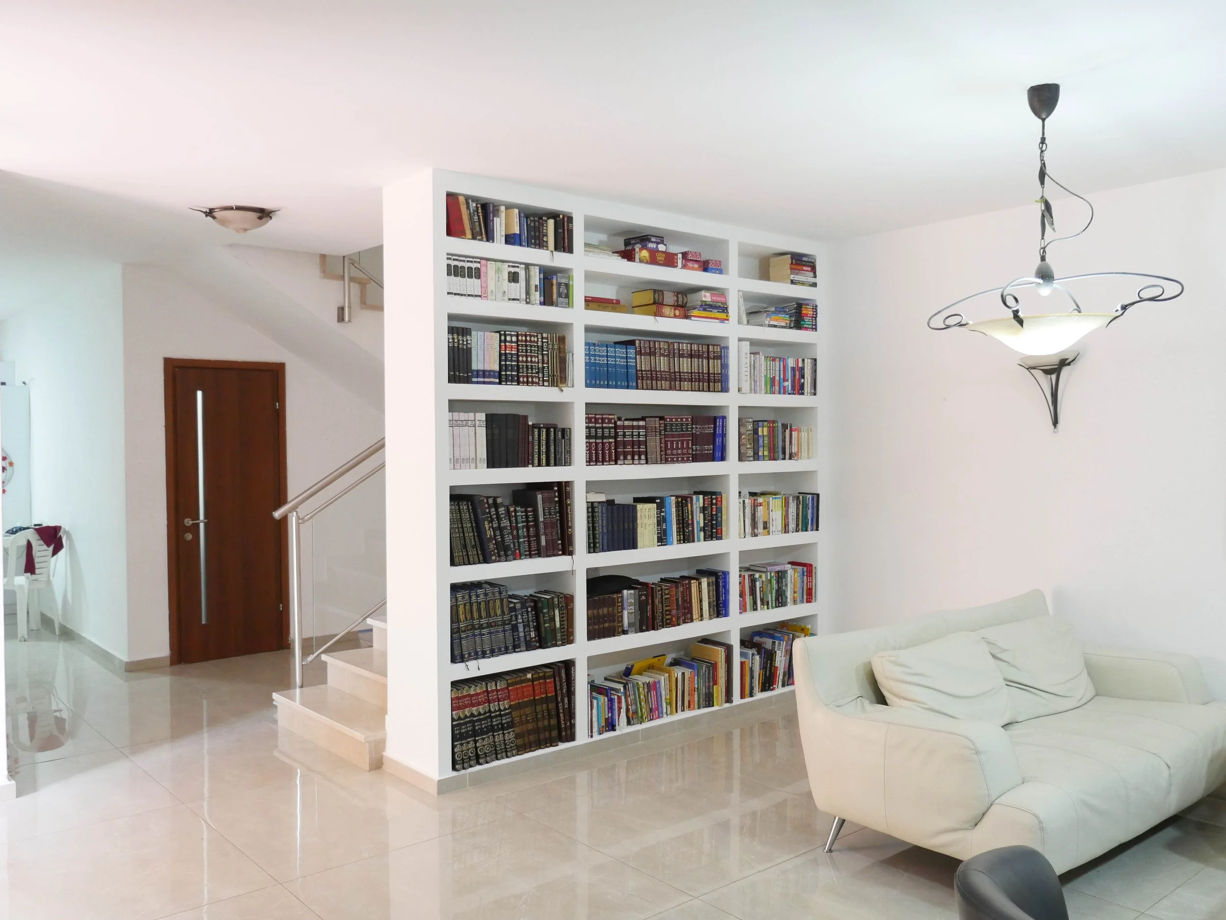 Custom built-in bookshelf installation for a residential living space in Halifax