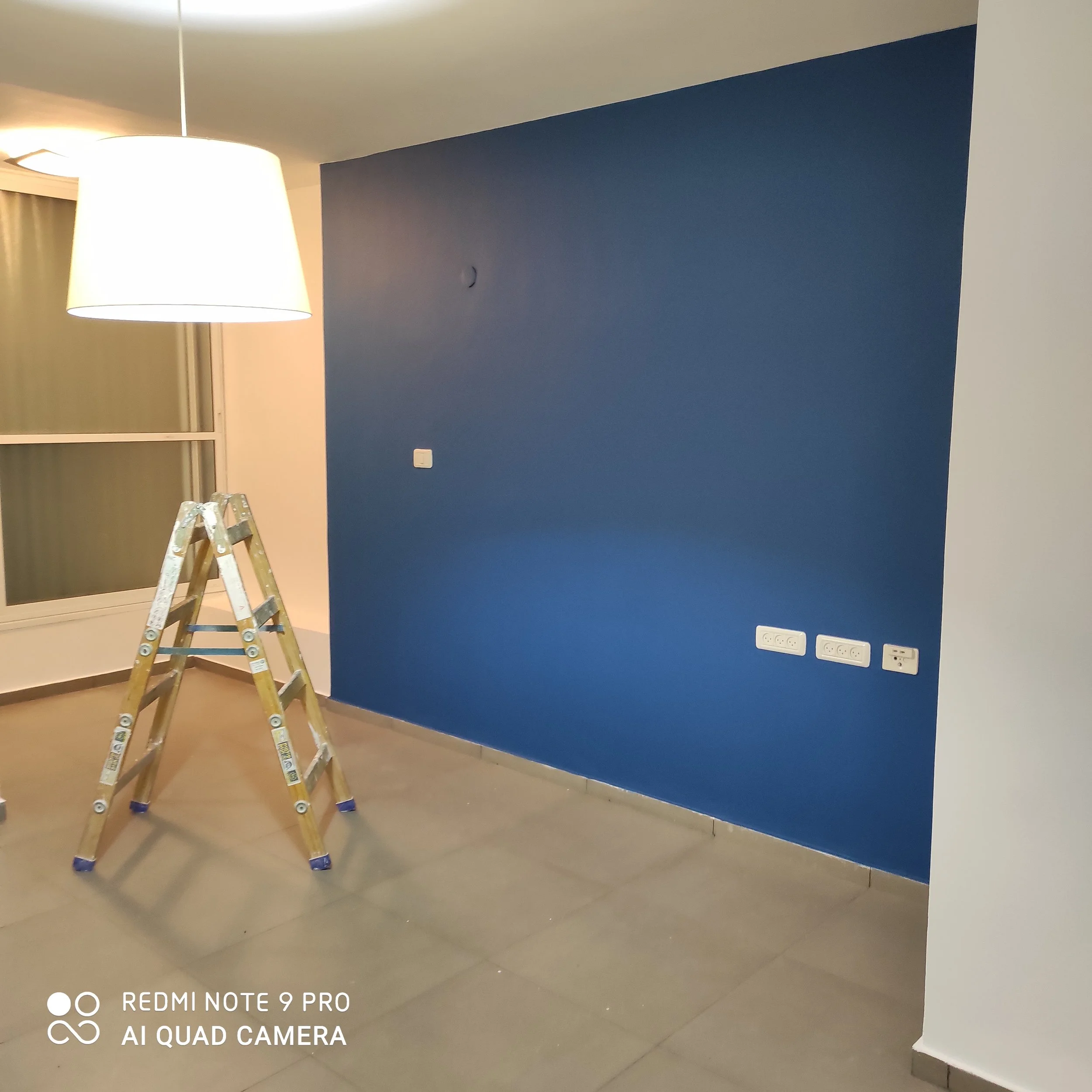 Accent wall painting completed with clean, modern finish in Dartmouth