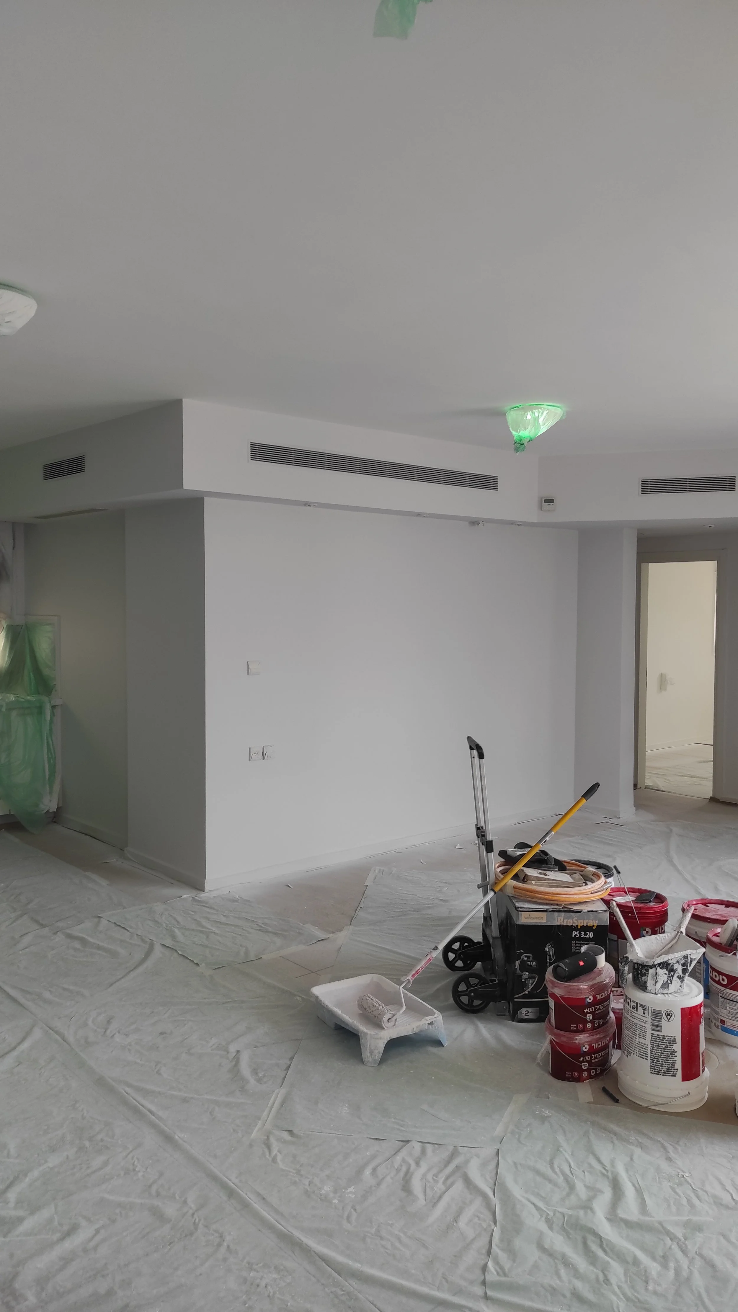 Condo repainting project in progress with full surface protection in Bedford