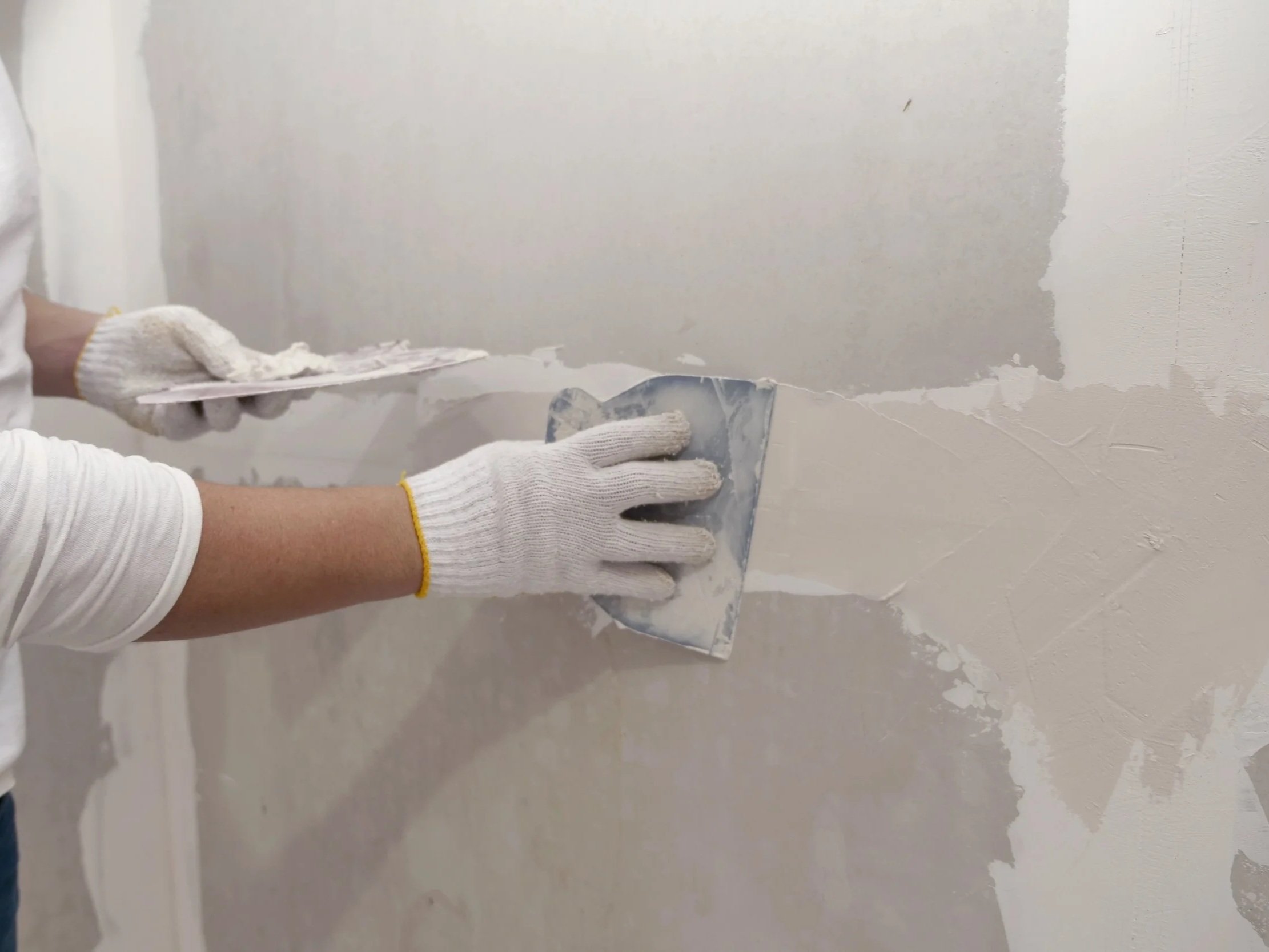 Professional drywall repair and wall patching before painting