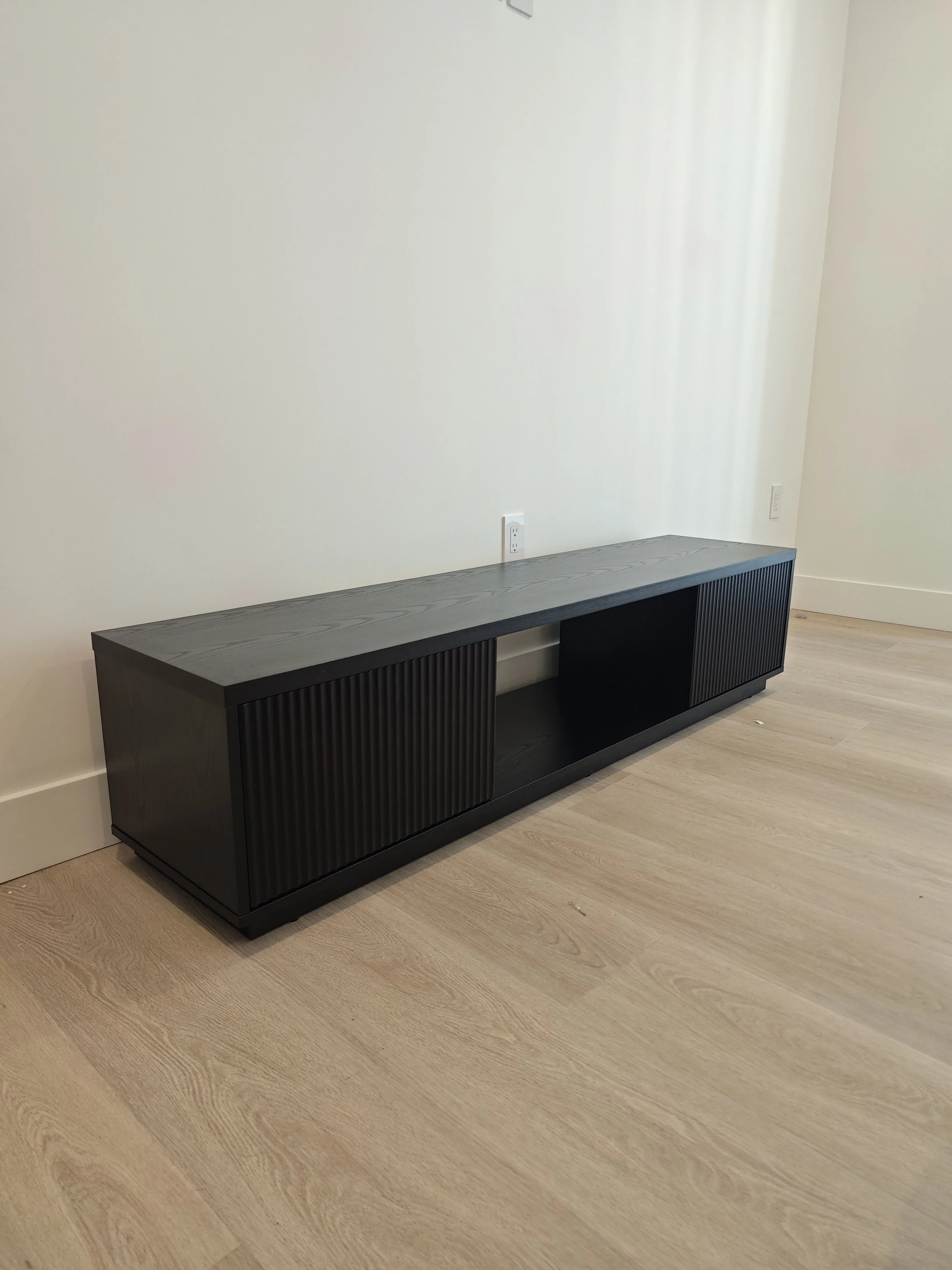 Furniture assembly completed in Charlottetown, PEI. Modern TV stand professionally assembled and installed with careful attention to alignment, stability, and finish. Another quality installation completed by Paul Handyman PEI.