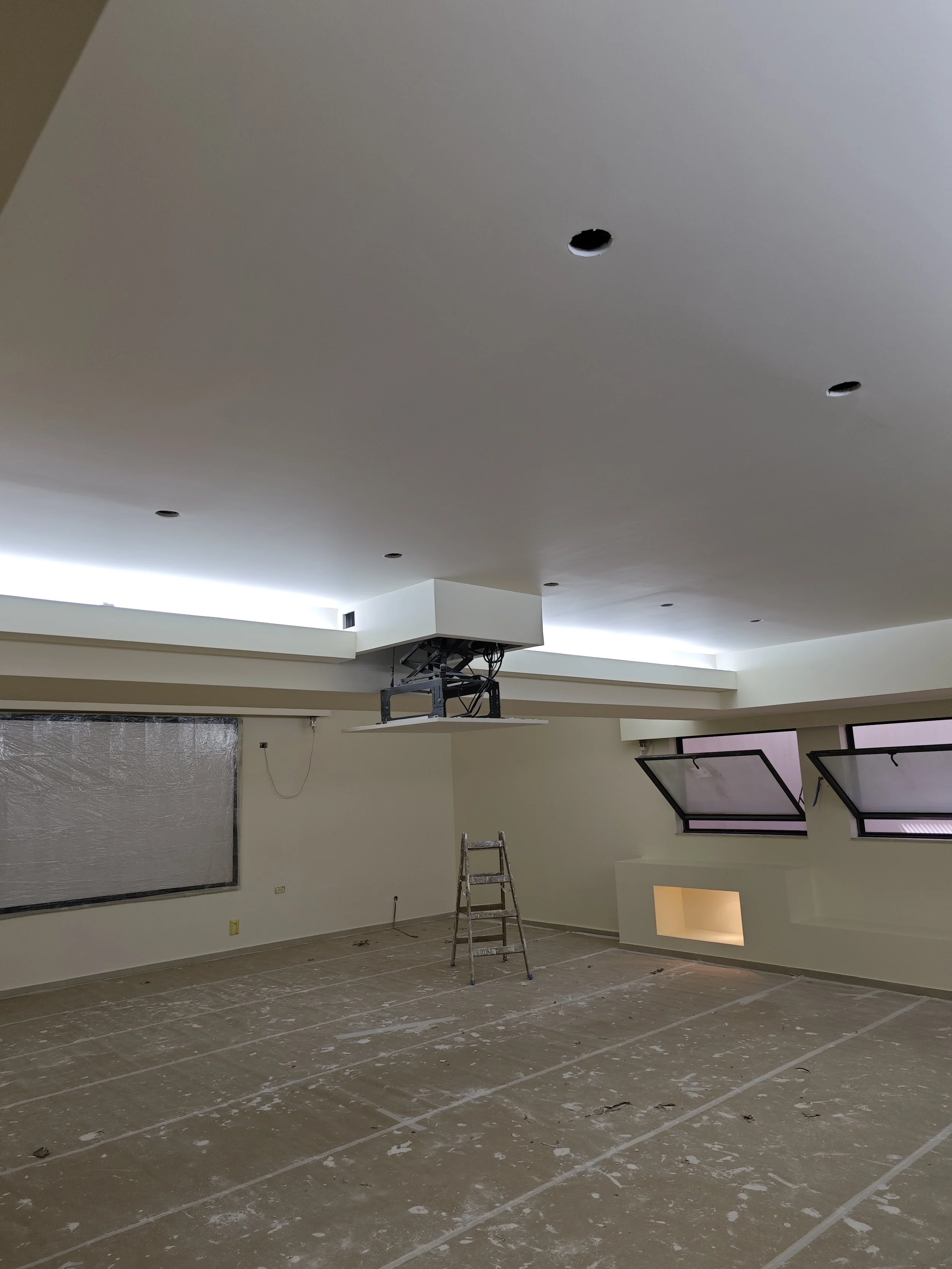 Basement repainting completed with clean, fresh finish for a residential project in Bedford
