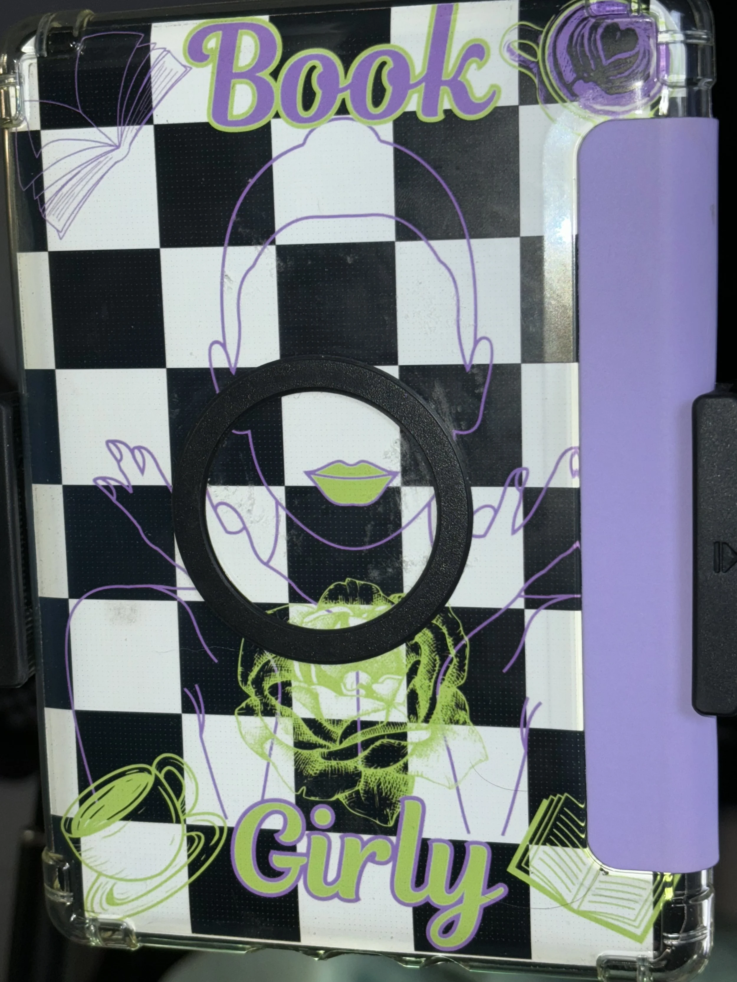 Decorative cover with a black and white checkerboard pattern, featuring line art illustrations of a girl with boarded-up glasses, a coffee mug, a book, and a rose, all in purple and green colors. The cover includes the words "Book Girl".
