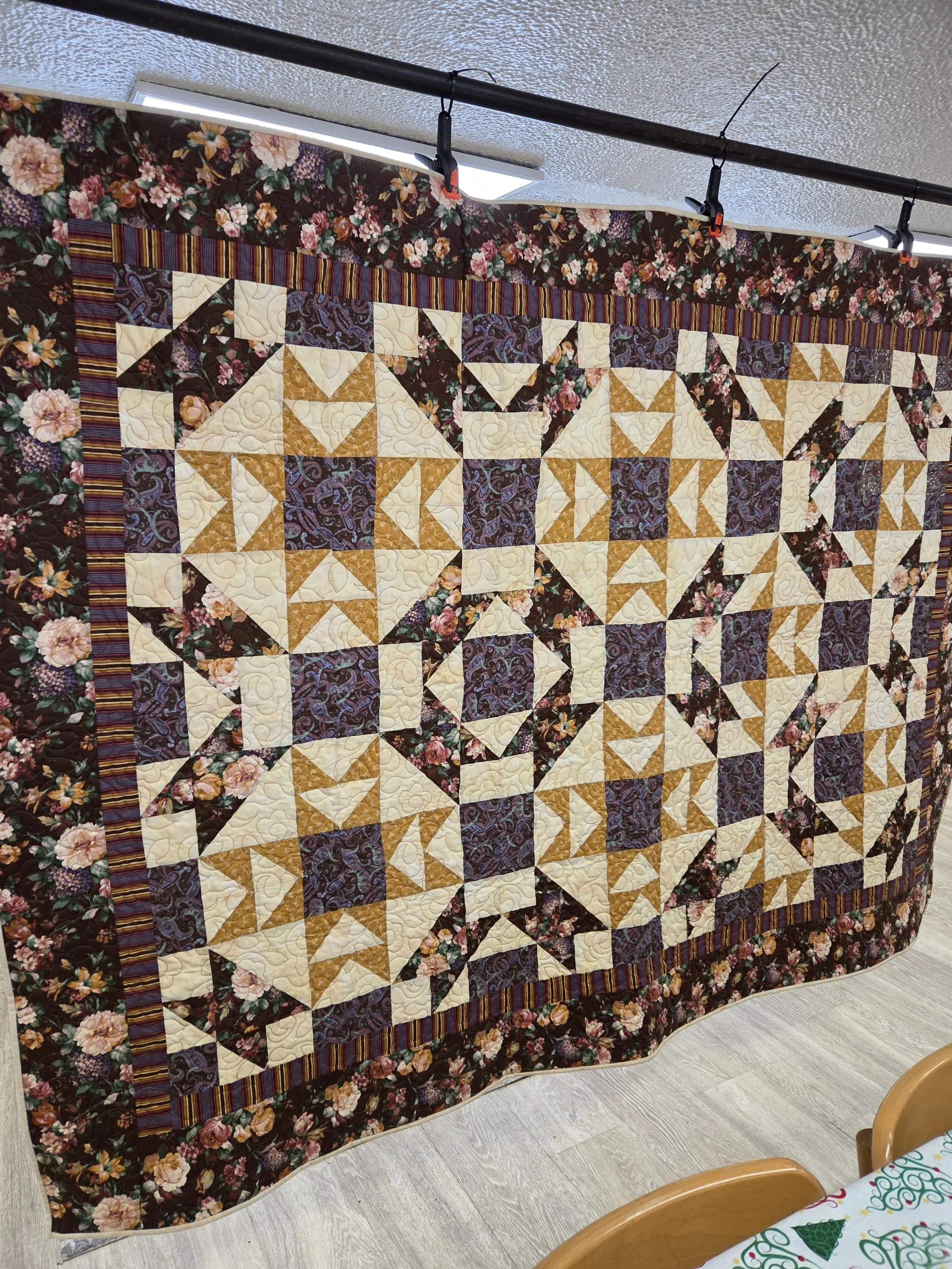 A quilt that church member Marcie Michaud quilted and Father Gary machine quilted presented to Scott Morrow.  
