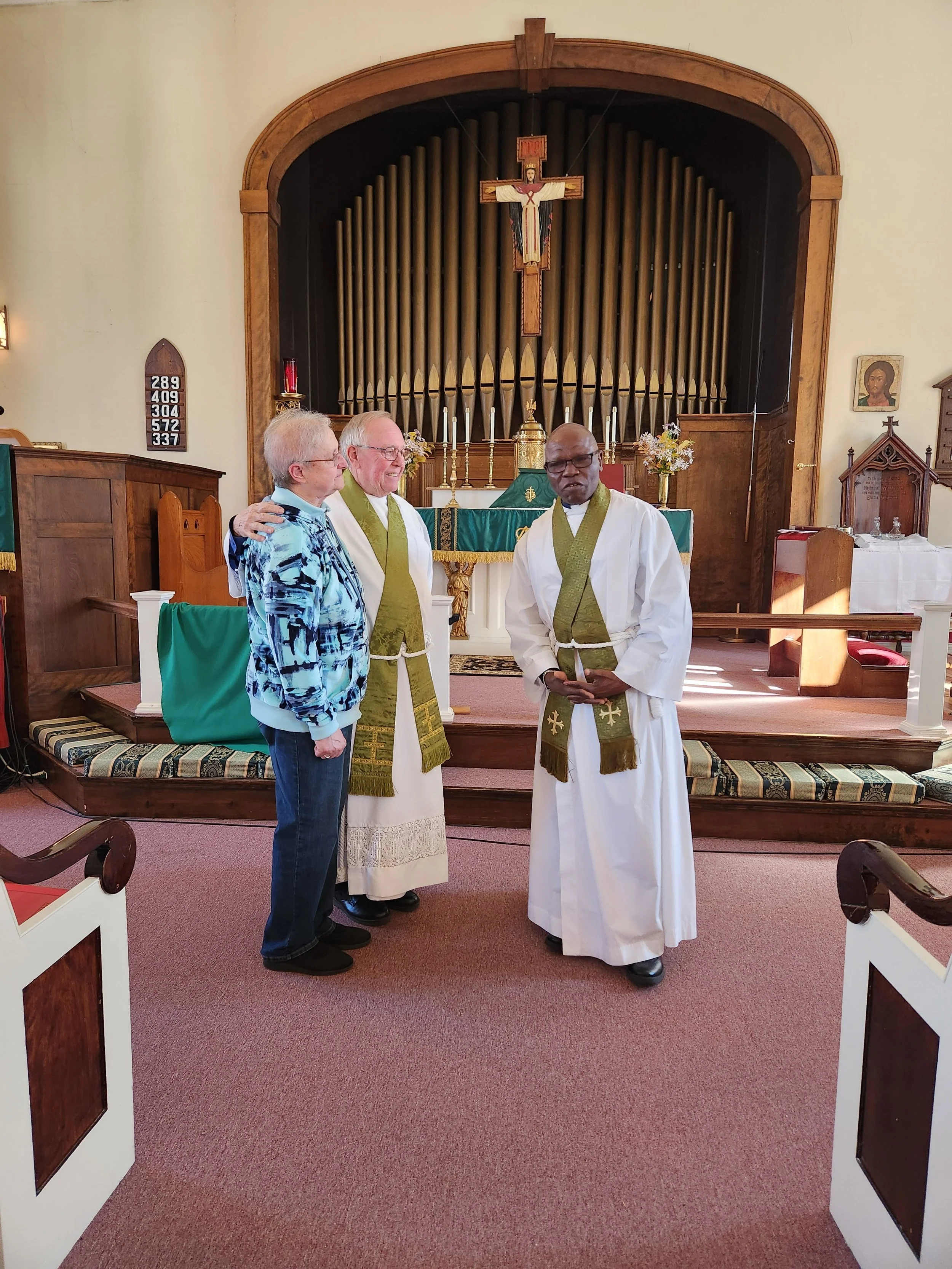 Father Gary and Diane Drinkwater receive an anniversary blessing from Father Francois (October 2024 ).