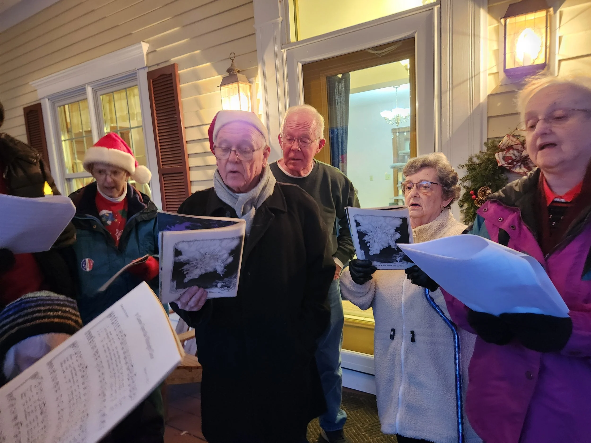 Christmas caroling 2024 (Betsy, Father Gary, Jim, Marcie, Diane D.)