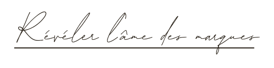 Texte écrit en cursif : "Révéler l'âme des marques".