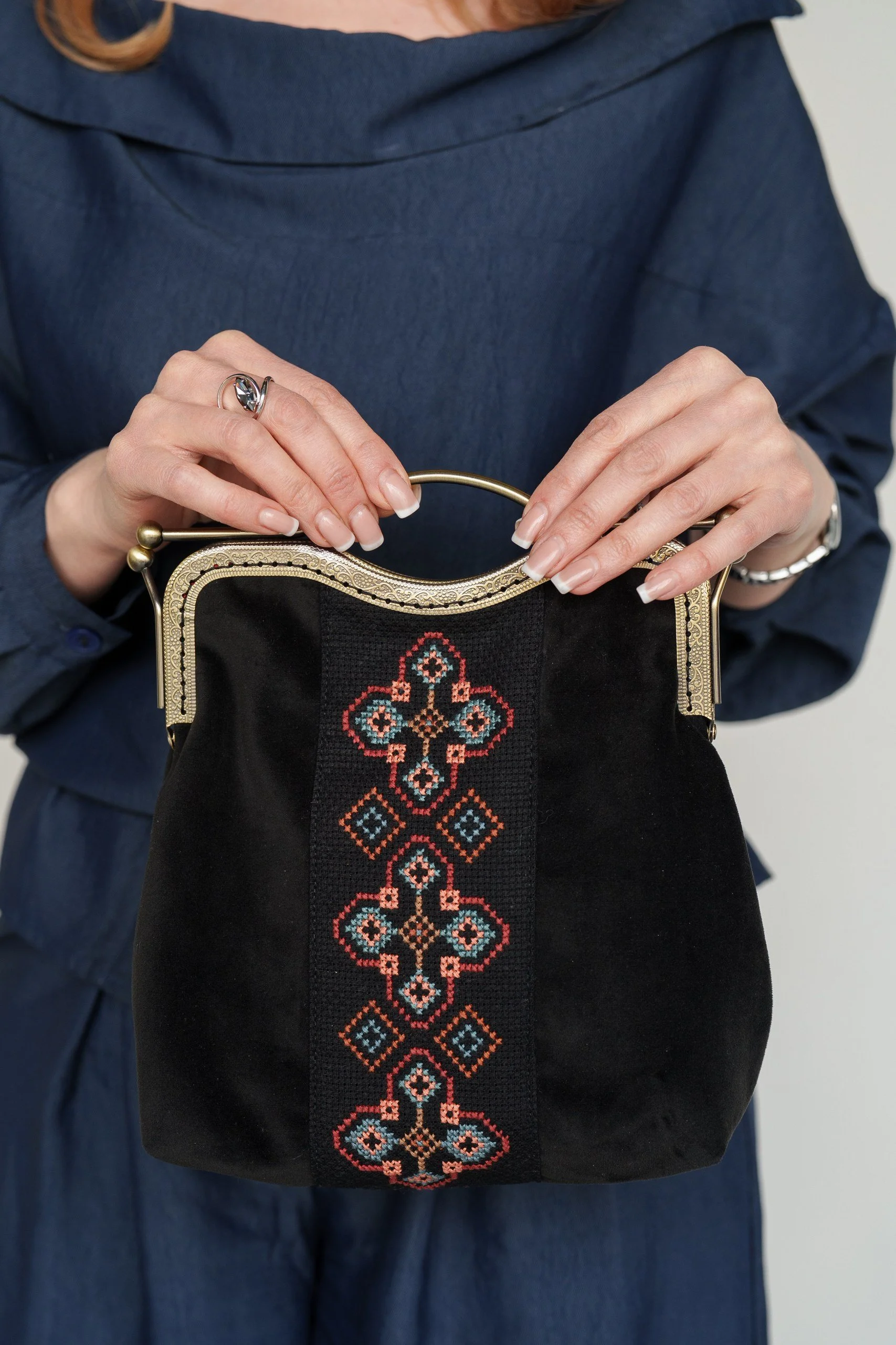 Large embroidered purse with metal handle and chain.jpg