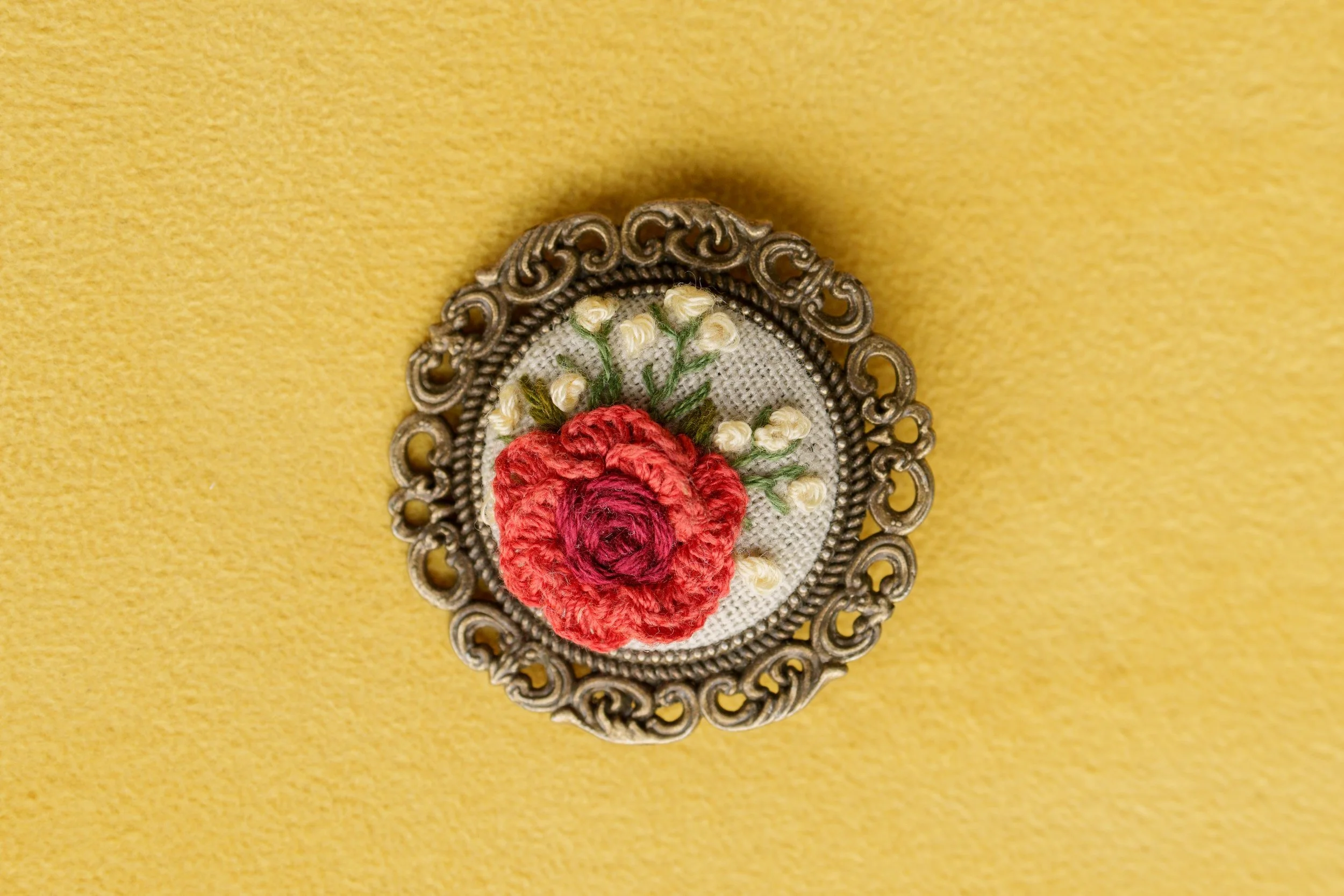 Embroidered brooch with red rose and white flowers.jpg