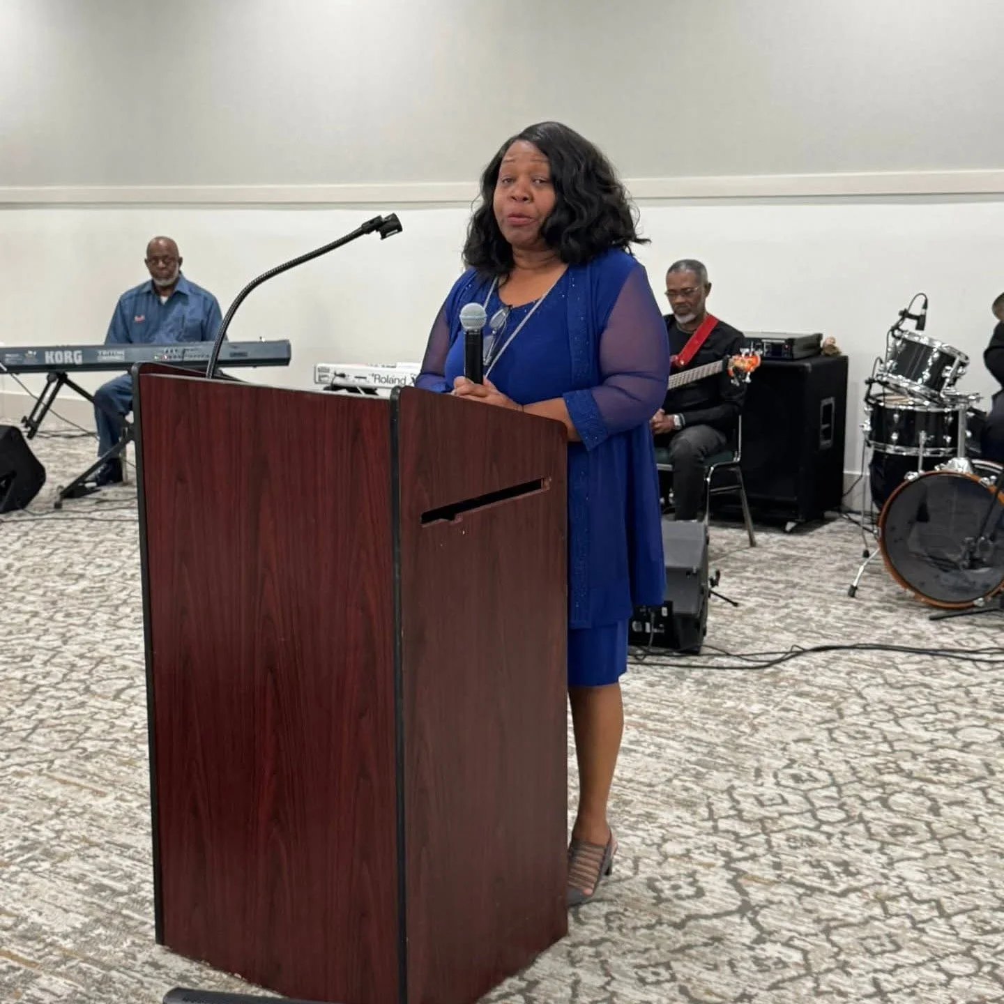 Gerrie Ford-Hardin addresses the crowd of seniors at the annual Joan Turner Senior Luncheon which she organizes every year to provide thanksgiving dinners to hundreds of seniors.