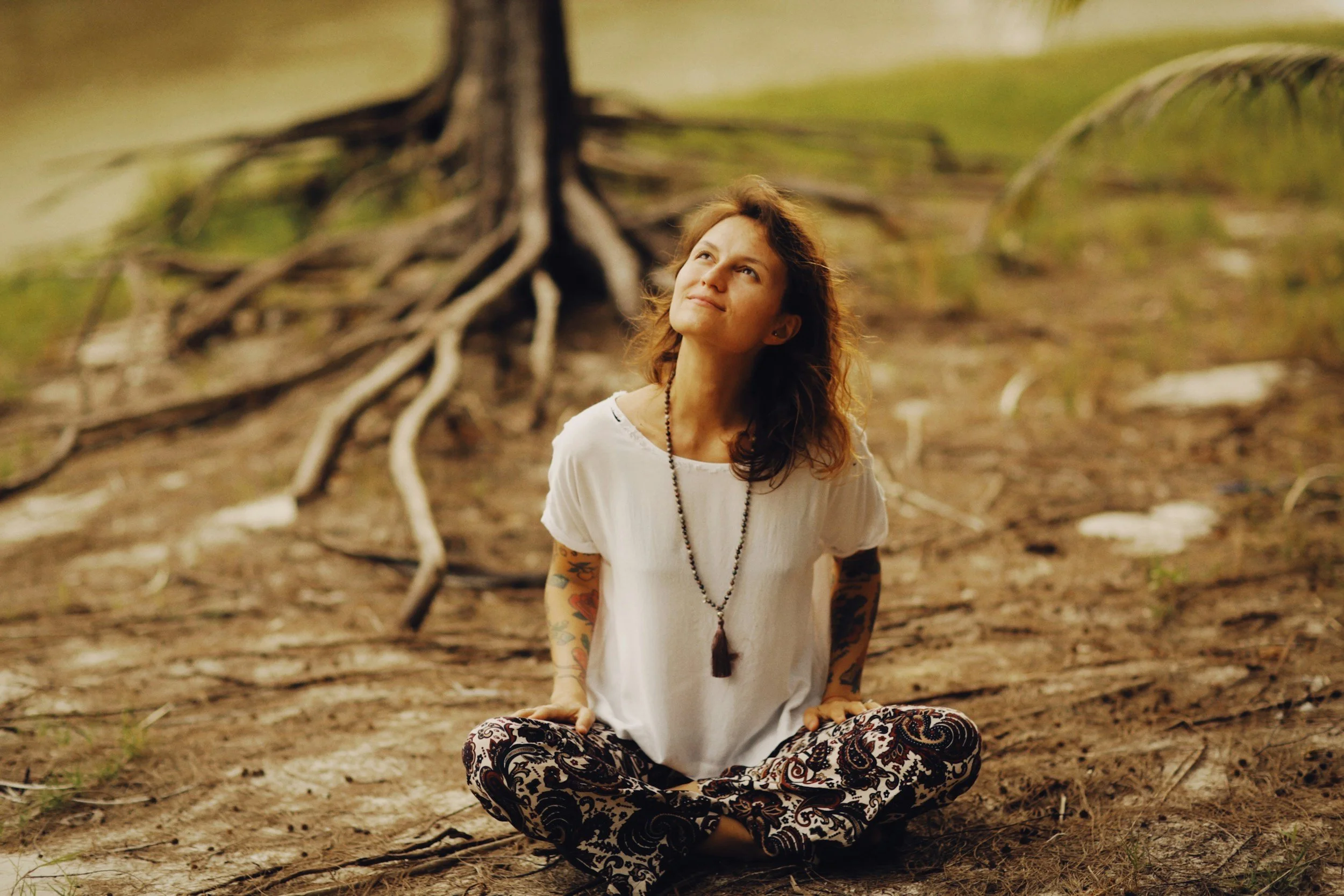 Symbolic artwork of a person connected to roots and ancestral lineage.