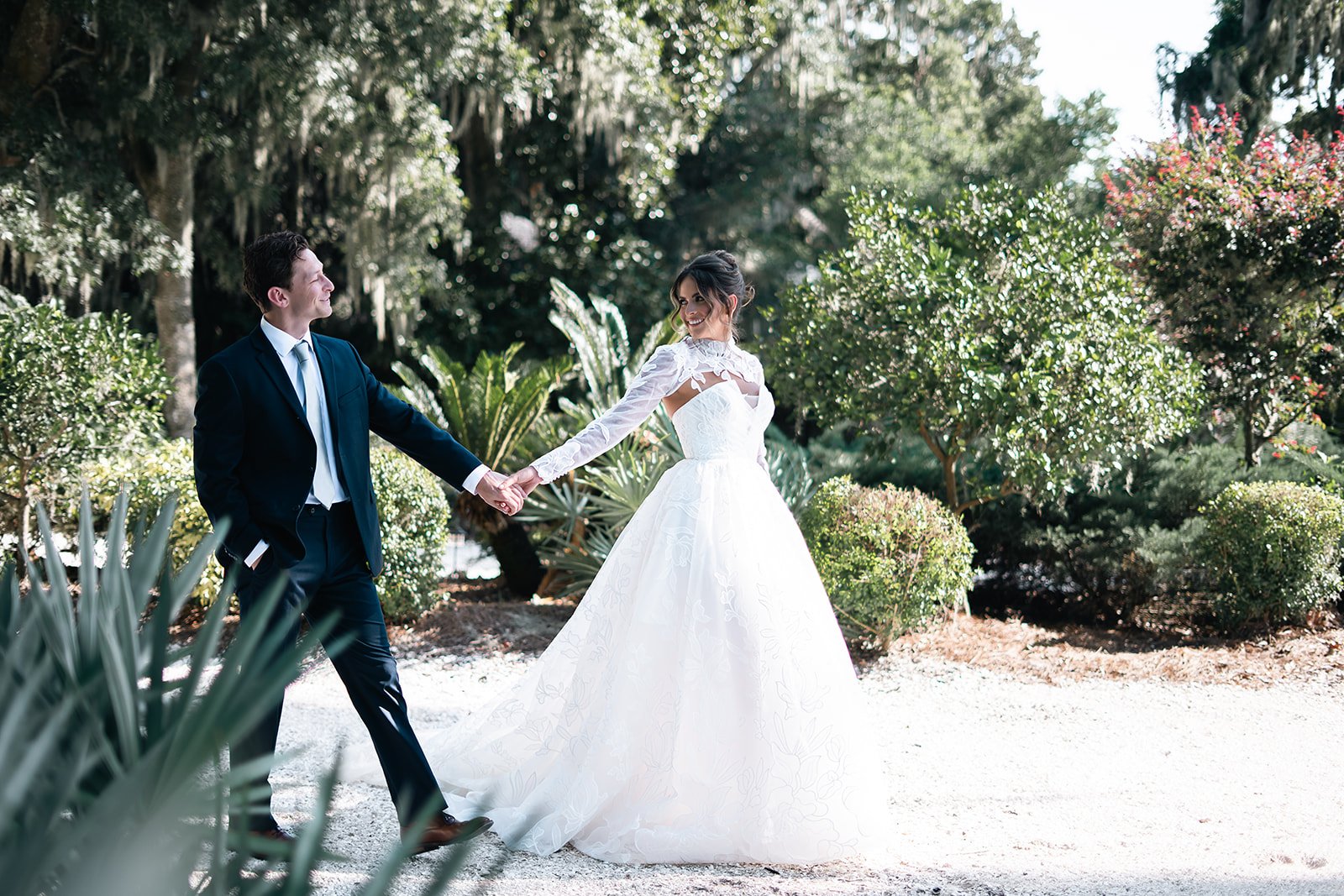 Bride and groom walking hand in hand during their intimate, Aguadilla, Puerto Rico elopement – captured by Karen Fabiola Photo, destination wedding photographer.