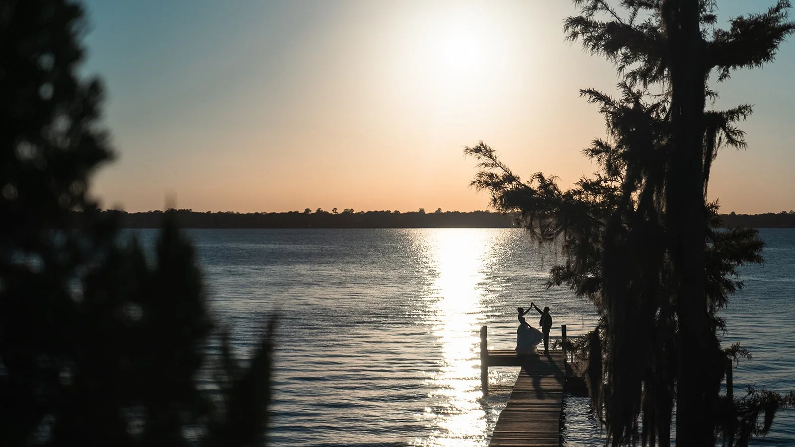 A joyful moment from an intimate Cabo Rojo, Puerto Rico elopement captured by Karen Fabiola Photo. The bride, in a flowing lace gown, holds hands with the groom in a dark suit as they walk together. Karen Fabiola Photo - Cabo Rojo Wedding Photographe
