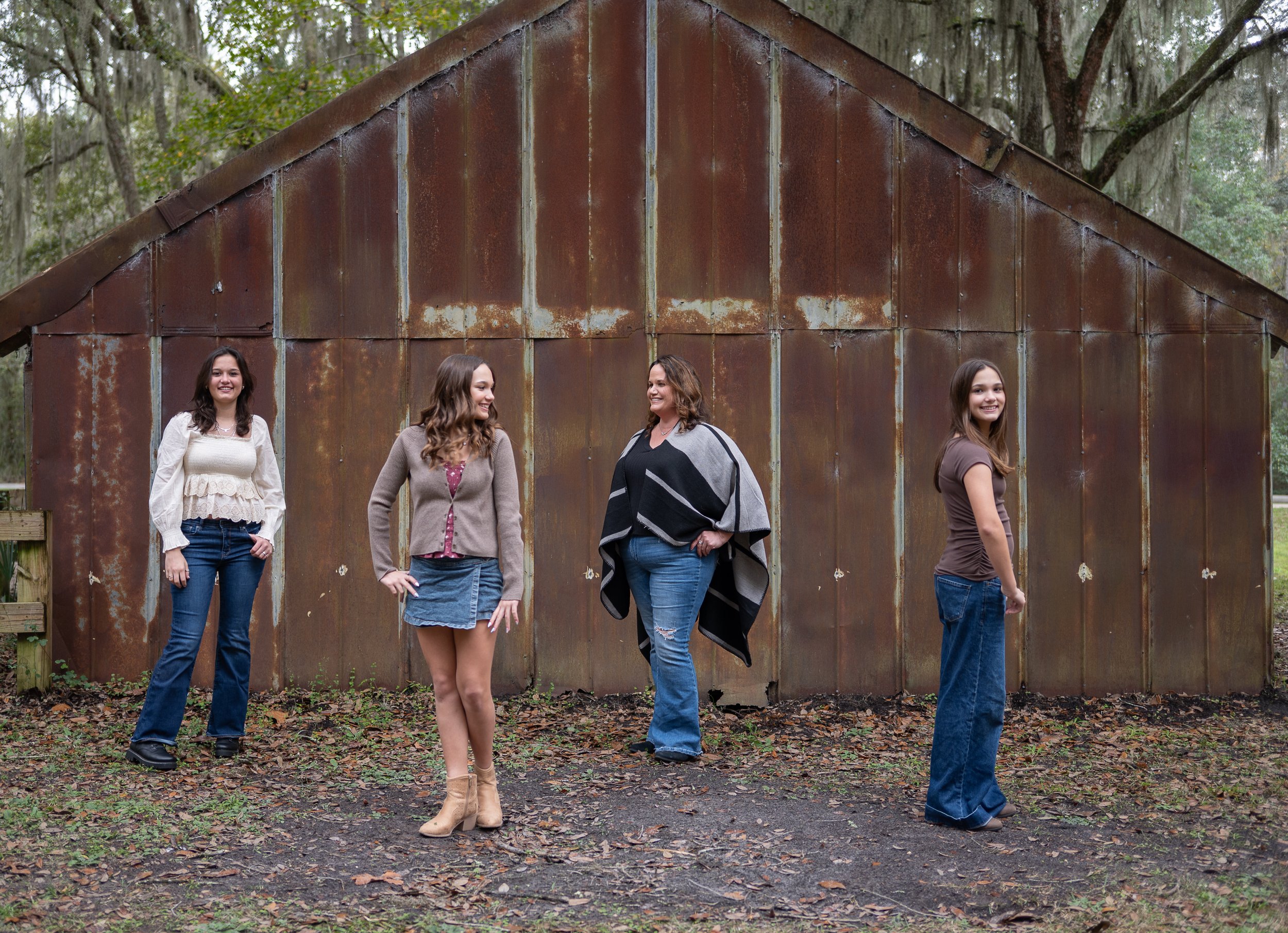 Mom and the girls in front of a barn