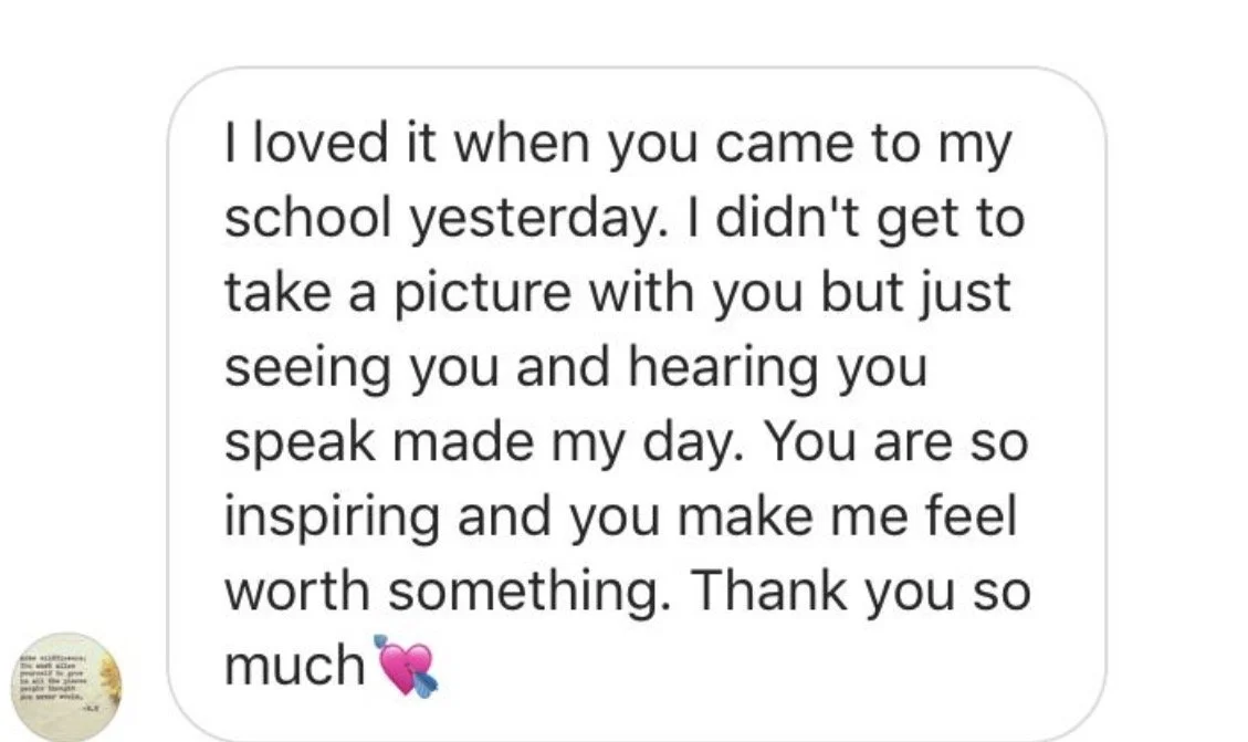 A text message expressing gratitude and admiration for someone who visited a school, mentioning feelings of inspiration and worth, ending with a pink and blue heart emoji.