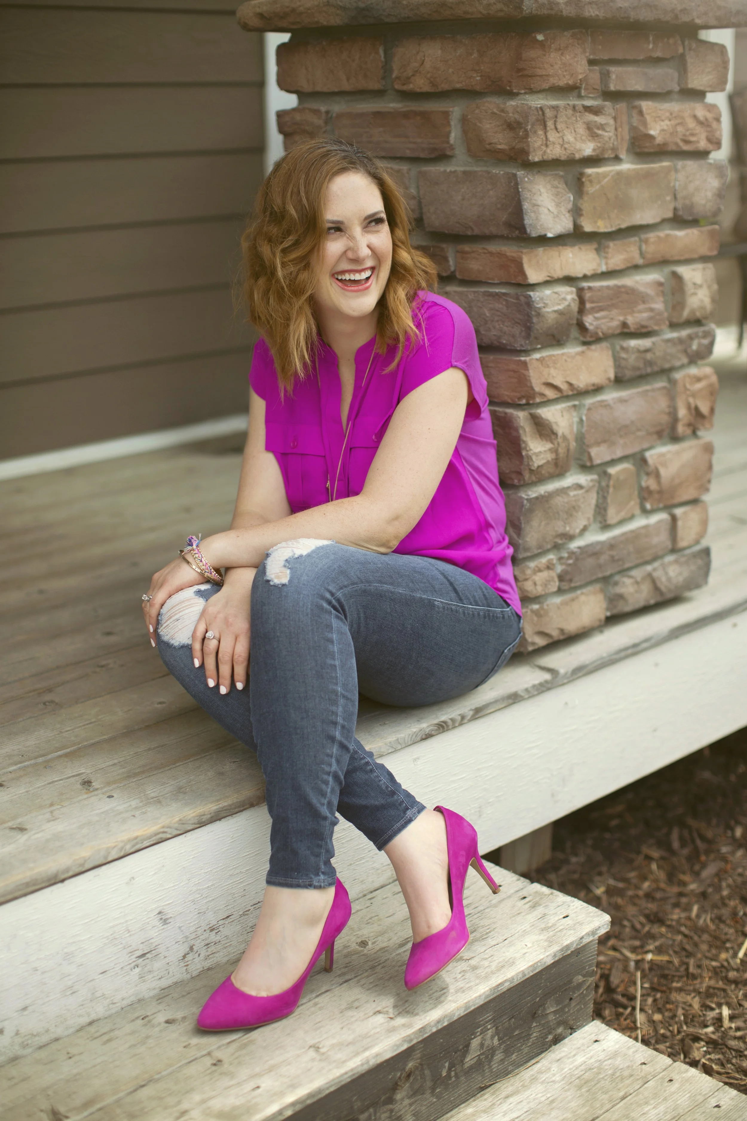 Becky Hunt seated outside in a bright setting, symbolizing calm and encouragement for grieving mothers