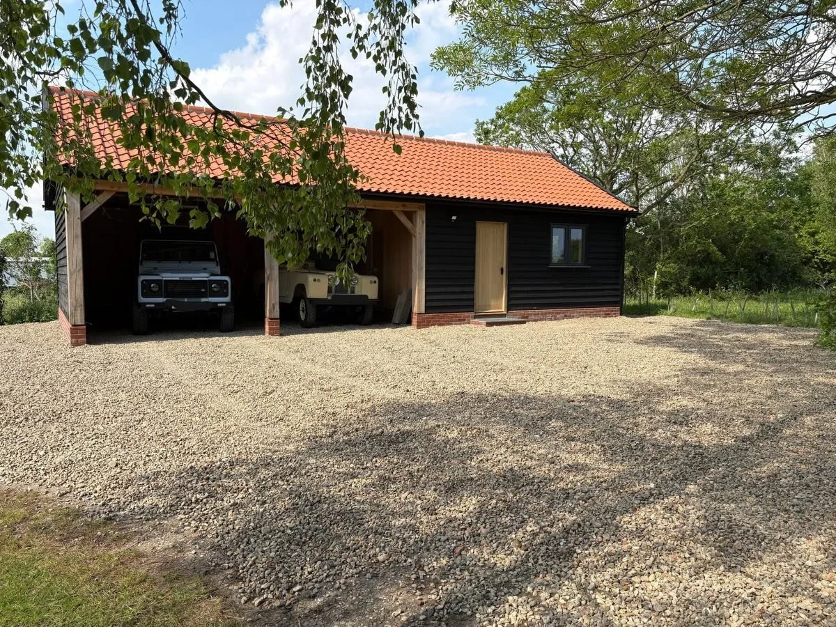 One year on and back to finish the details.
We recently returned to this oak cartlodge project to add the front steps and complete the stone driveway and parking area &mdash; tying everything together nicely. Great to see it all settled in and being 