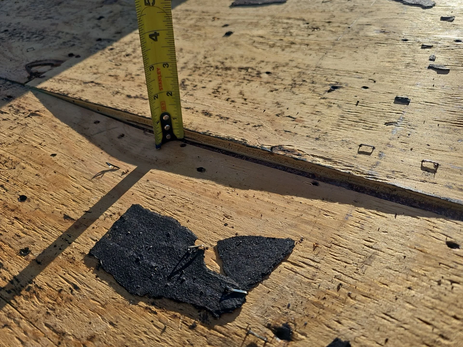 Example of damaged roof decking seam and repair context where Buckle Down roofing cleats are used to reinforce weak areas during metal roof installation
