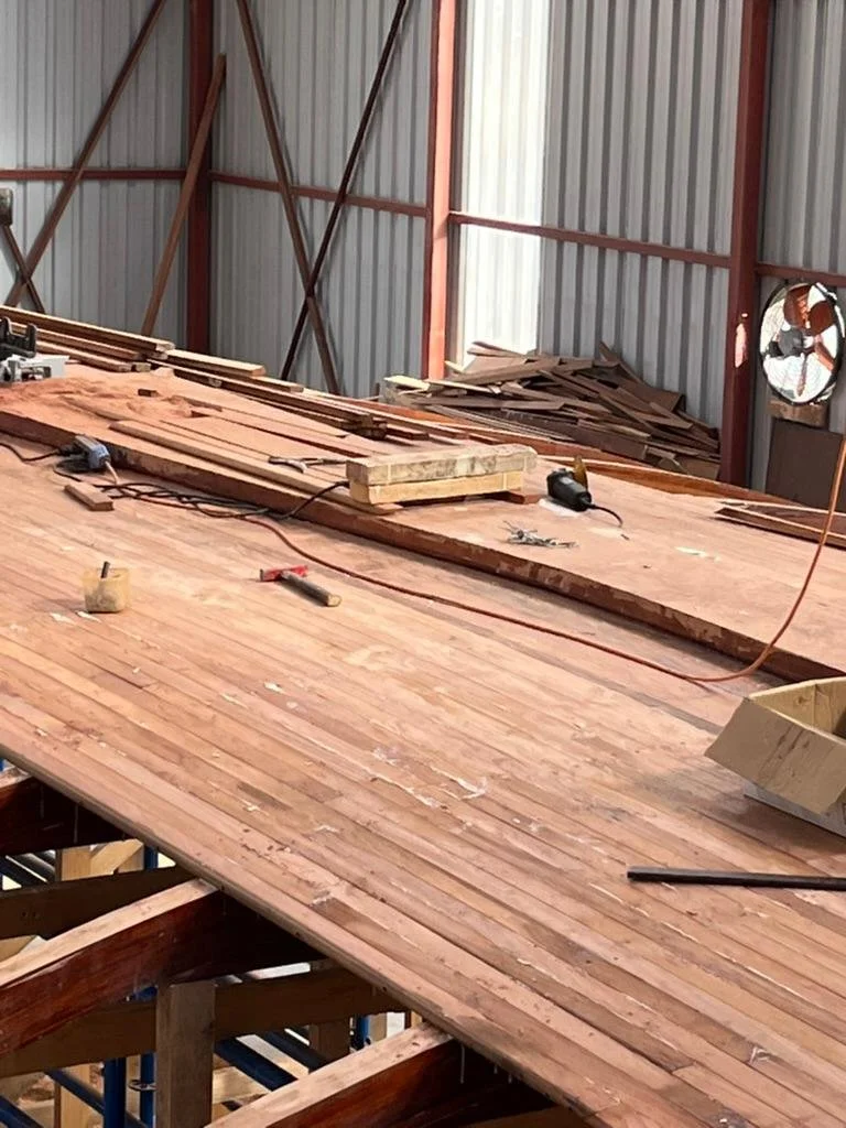The planking is glued and clamped to the frames