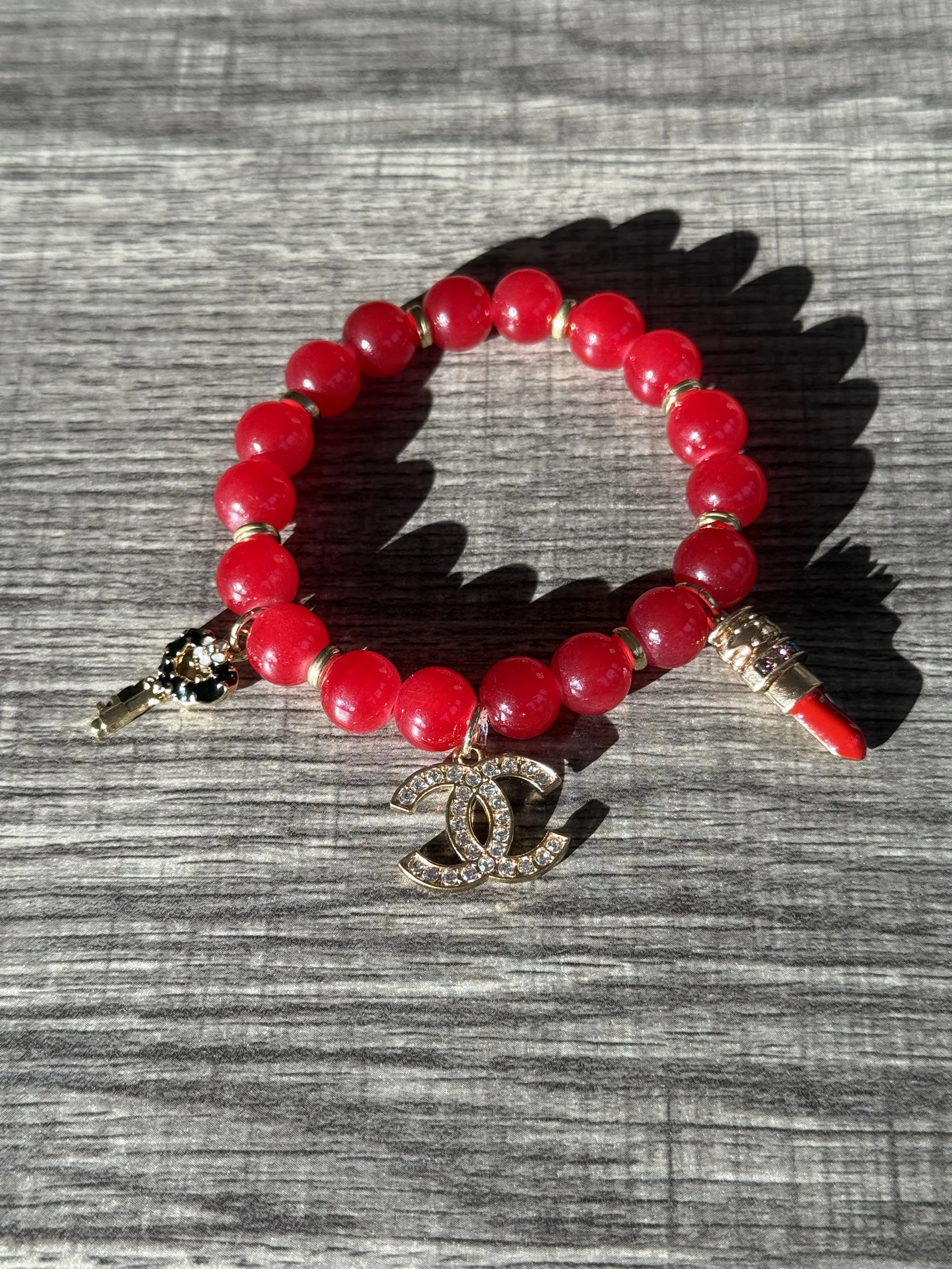 Red Charm Bracelet with Elegant Accents