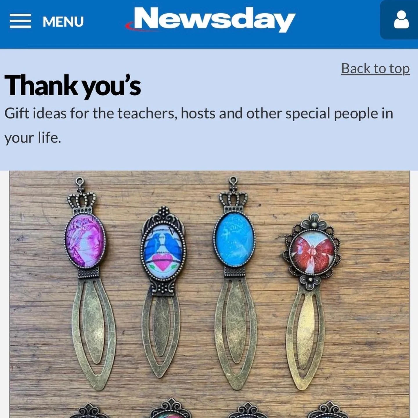 Four decorative keychains with different oval portraits and metal handles on a wooden surface, used as gift ideas for teachers or special people.