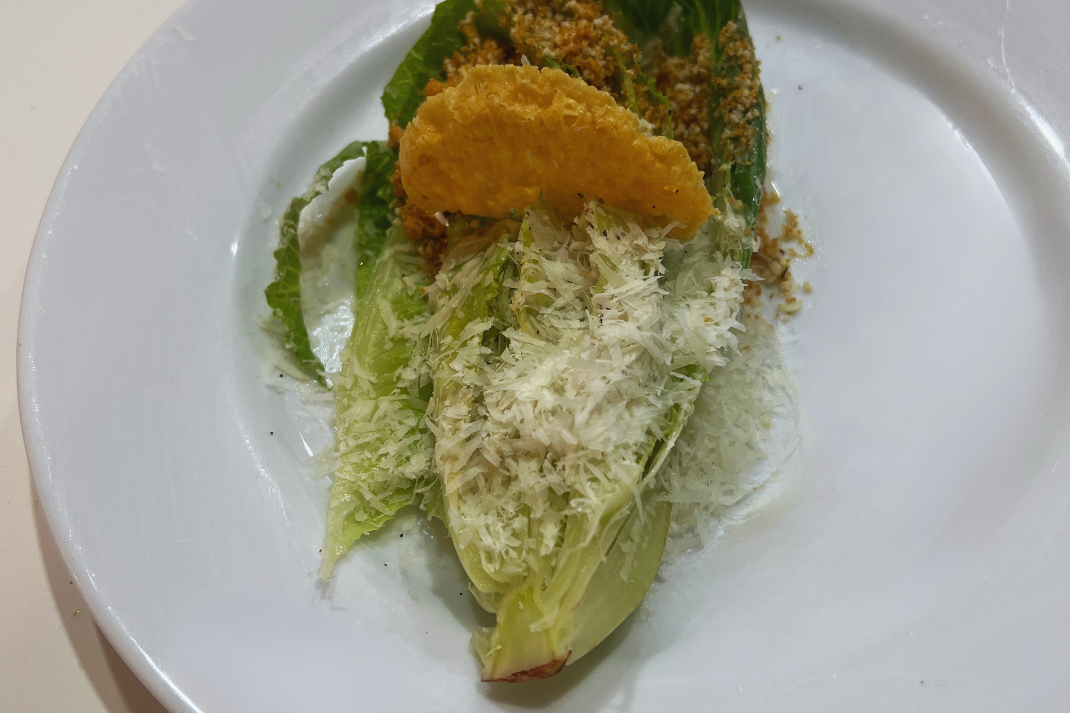Caesar salad, grana padano, sourdough bread crumbs, parm crisp