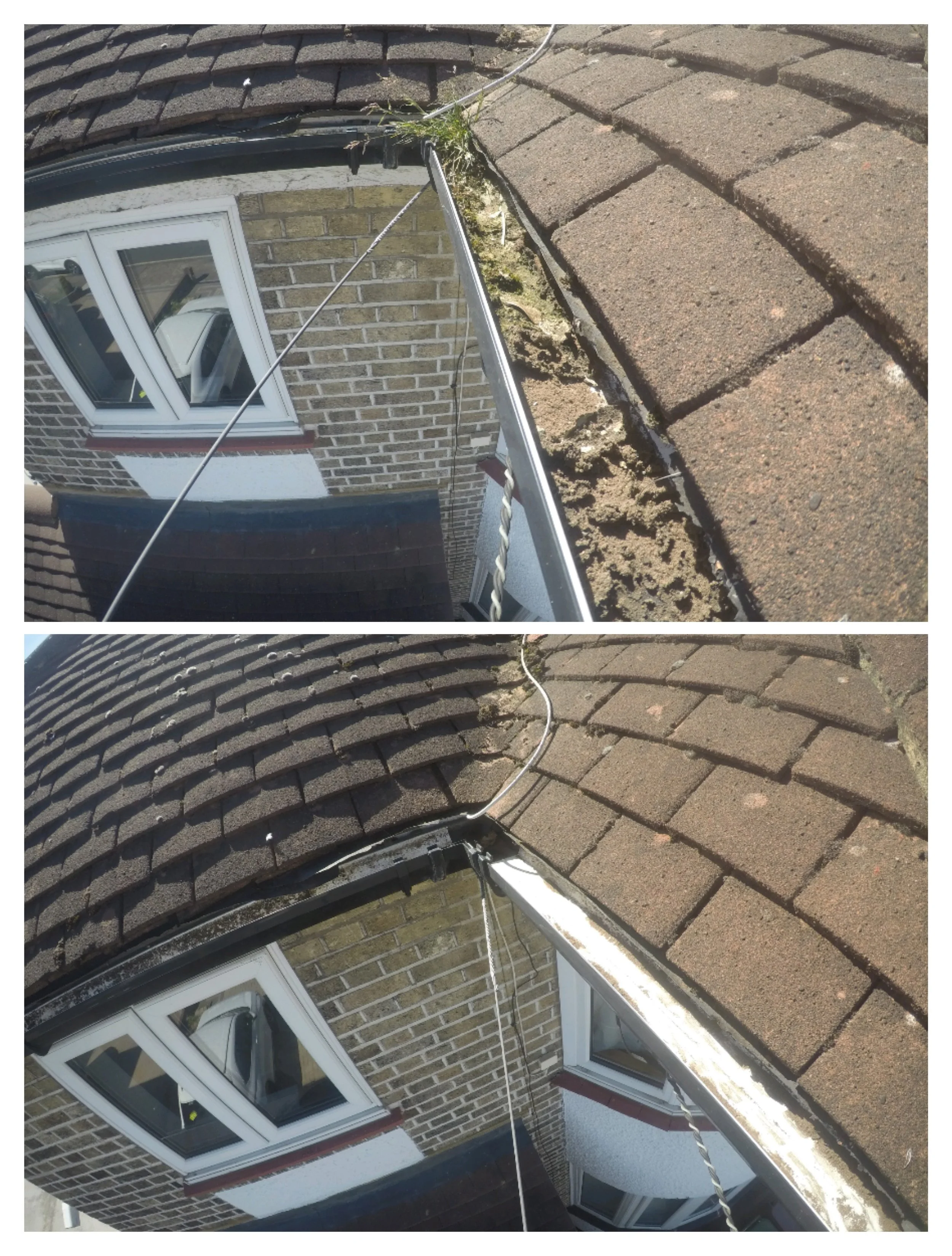 Photo of a house with brick walls and a window; the roof appears damaged with a section lifted showing underlayment and shingles, and a cable runs across the roof.