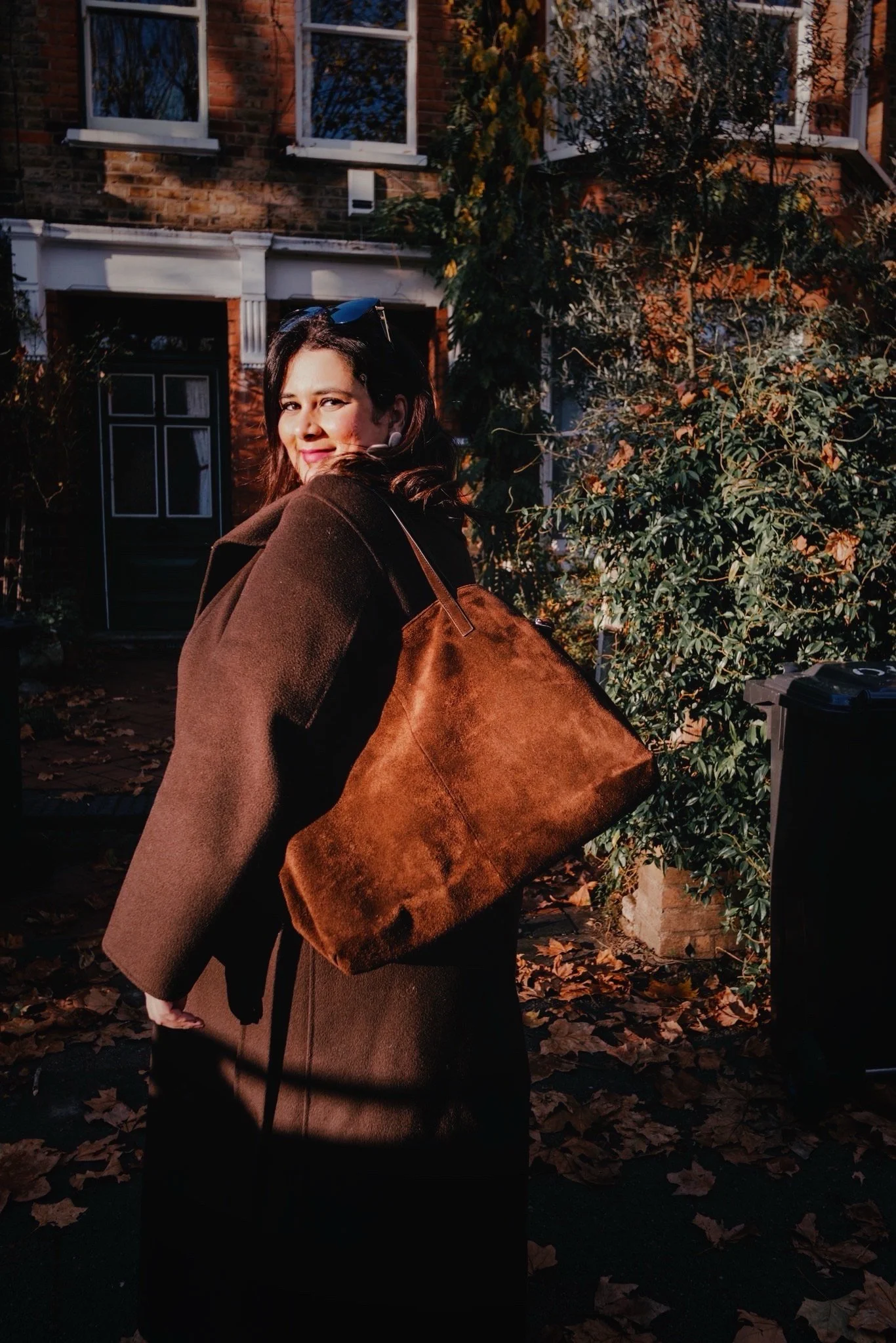 Natalia, astrocartography reader and travel curator, smiling in warm autumn sunlight — Astromap Voyages