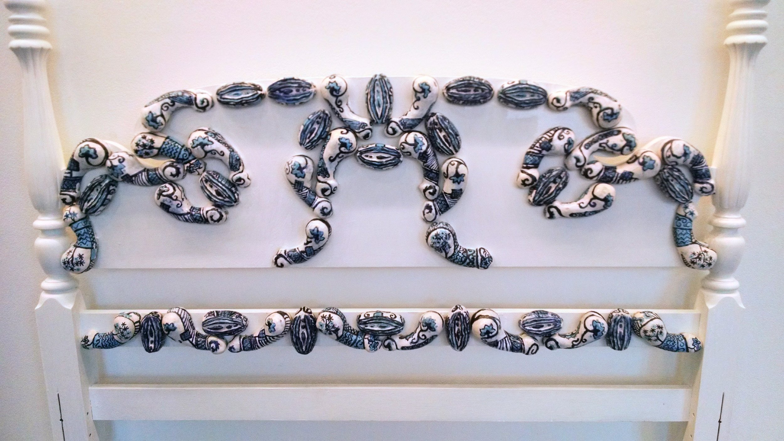 Rocco headboard of Vulvas and penis'