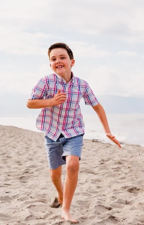 Dexter, our founder running in the sand.