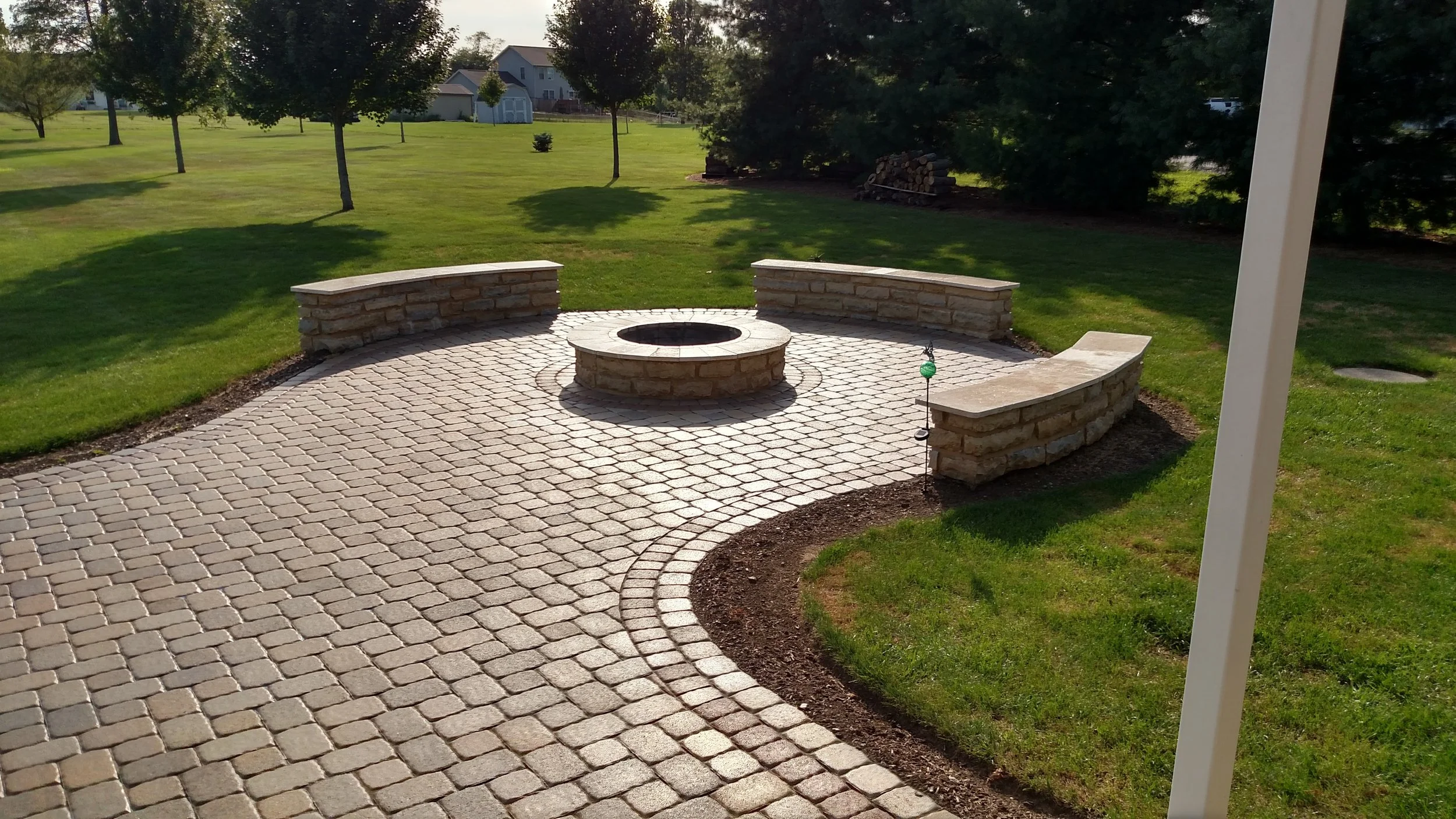 stone fire ring - and patio - and stone bench.jpg