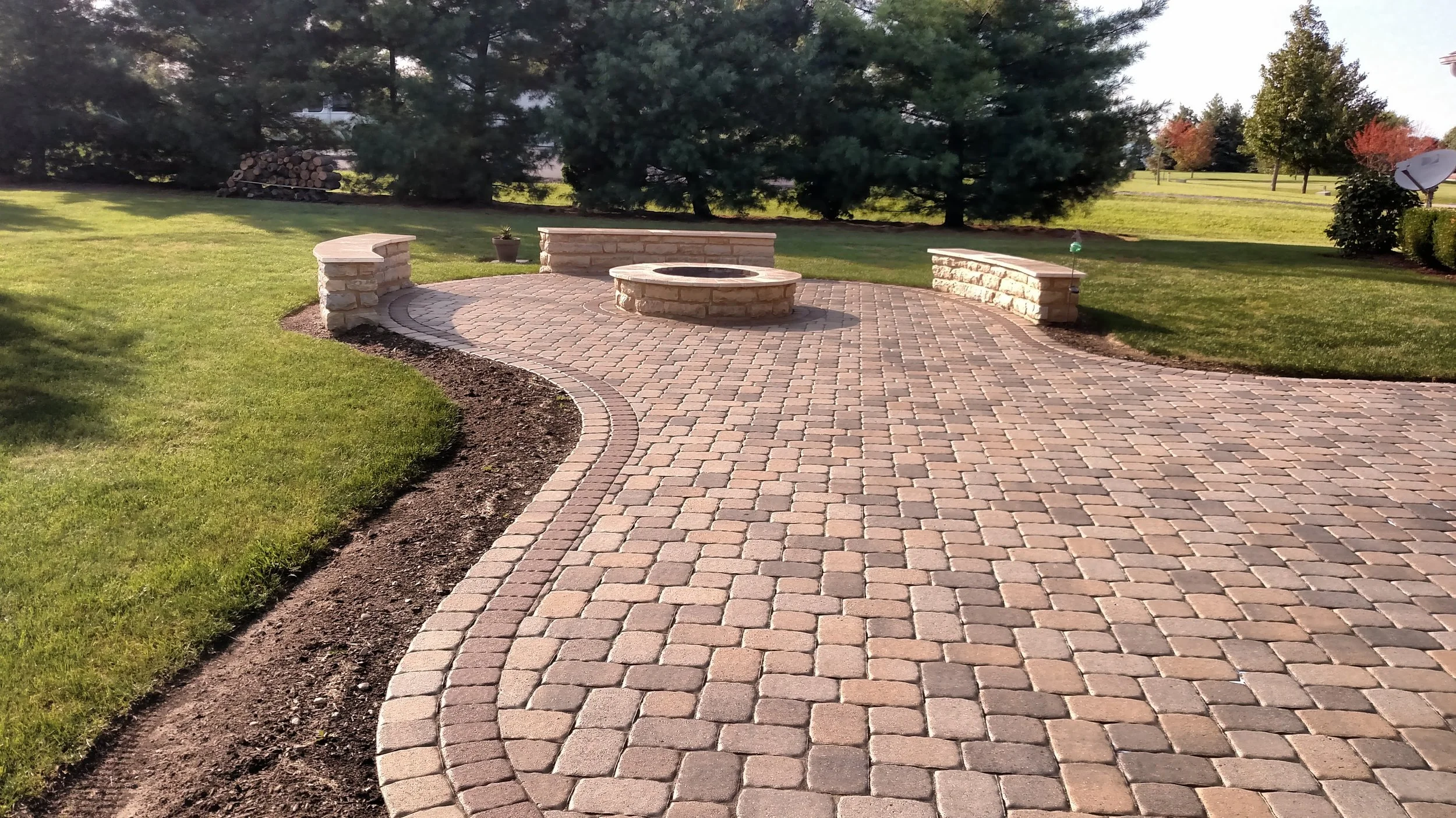 Patio pavers and stone retaining and stone fire ring.jpg