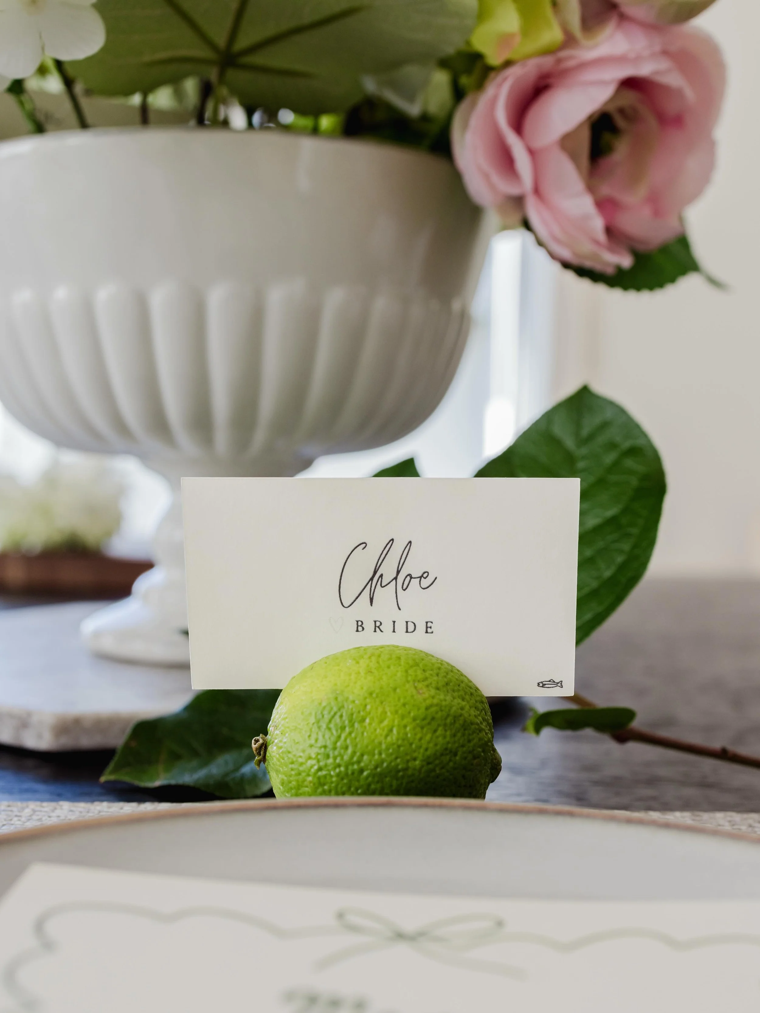 A place card does more than tell guests where to sit.

With fresh produce having a moment in event design, these lime place cards brought a fresh, seasonal feel to the table while serving a practical purpose&mdash;helping guests find their seat and t