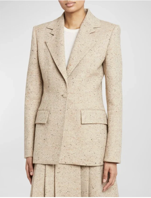 Beige blazer with a subtle woolen texture worn over a white top