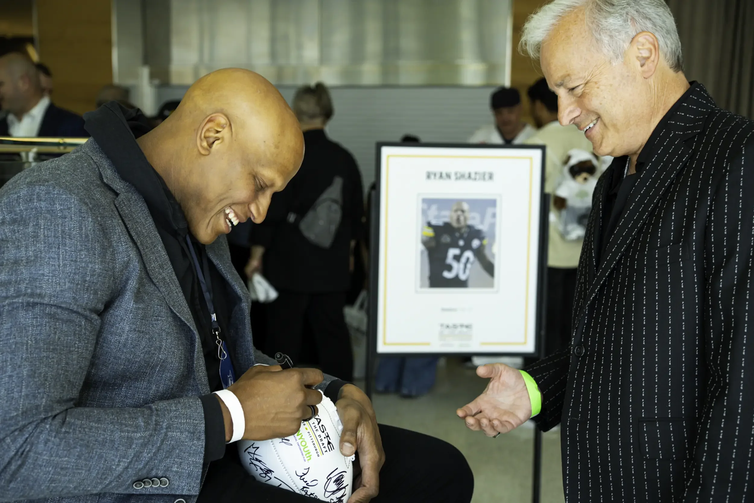 Ryan Shazier signing football for a fan