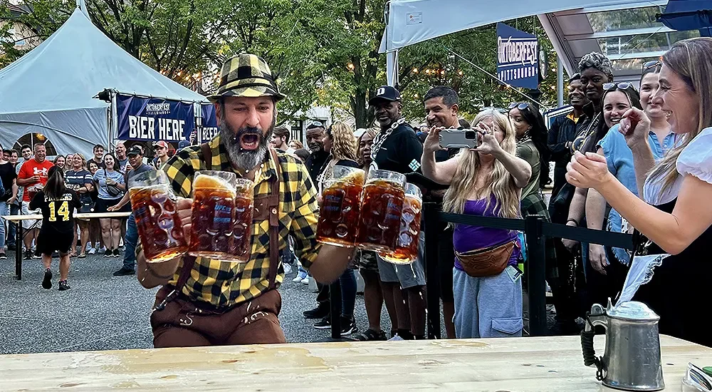 Man running with beer steins