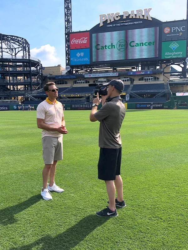 Aaron Cohn and cameraman on PNC Park Field